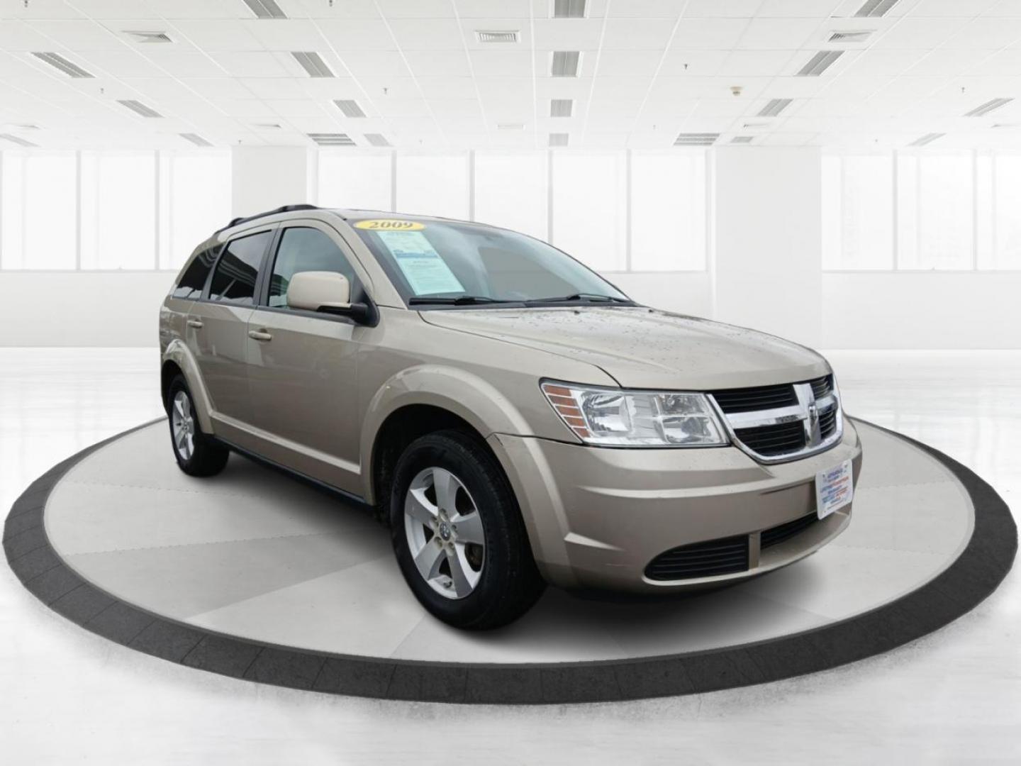 2009 Light Sandstone Metallic Dodge Journey SXT (3D4GG57V09T) with an 3.5L V6 SOHC 24V engine, 6-Speed Automatic Overdrive transmission, located at 1230 East Main St, Xenia, OH, 45385, (937) 908-9800, 39.688026, -83.910172 - Photo#0