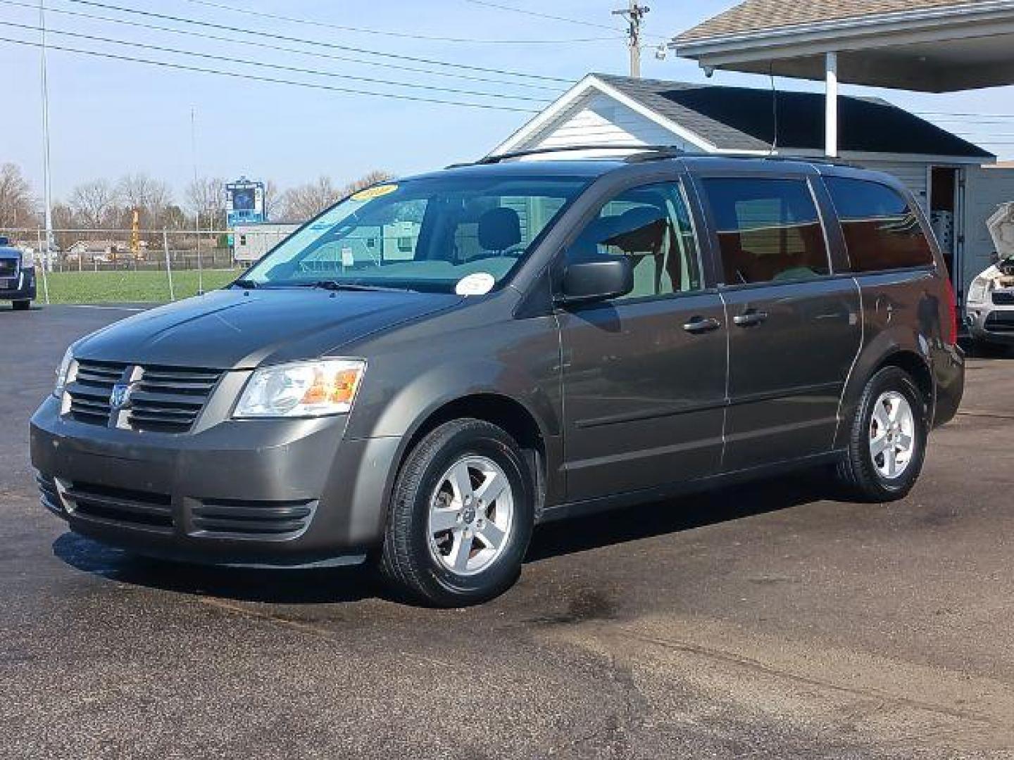 2010 Dark Cordovan Pearl Dodge Grand Caravan Hero (2D4RN3D16AR) with an 3.8L V6 OHV 12V engine, 6-Speed Automatic transmission, located at 4508 South Dixie Dr, Moraine, OH, 45439, (937) 908-9800, 39.689976, -84.218452 - Photo#2