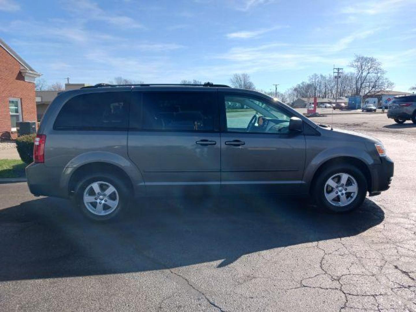 2010 Dark Cordovan Pearl Dodge Grand Caravan Hero (2D4RN3D16AR) with an 3.8L V6 OHV 12V engine, 6-Speed Automatic transmission, located at 4508 South Dixie Dr, Moraine, OH, 45439, (937) 908-9800, 39.689976, -84.218452 - Photo#4