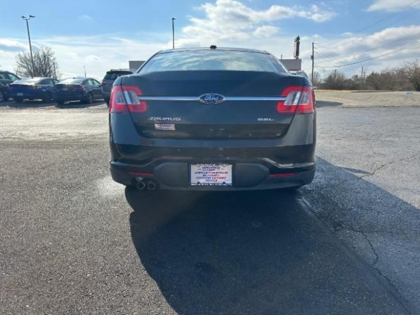 2010 Tuxedo Black Metallic Ford Taurus SEL FWD (1FAHP2EW5AG) with an 3.5L V6 DOHC 24V engine, 6-Speed Automatic transmission, located at 1099 N County Rd 25A , Troy, OH, 45373, (937) 908-9800, 40.057079, -84.212883 - Photo#4