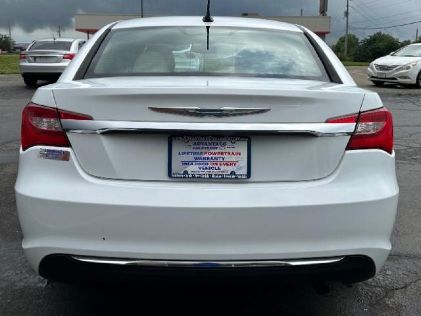 2011 White Gold Chrysler 200 Touring (1C3BC1FB3BN) with an 2.4L L4 DOHC 16V engine, 6-Speed Automatic transmission, located at 880 E. National Road, Vandalia, OH, 45377, (937) 908-9800, 39.891918, -84.183594 - Photo#4