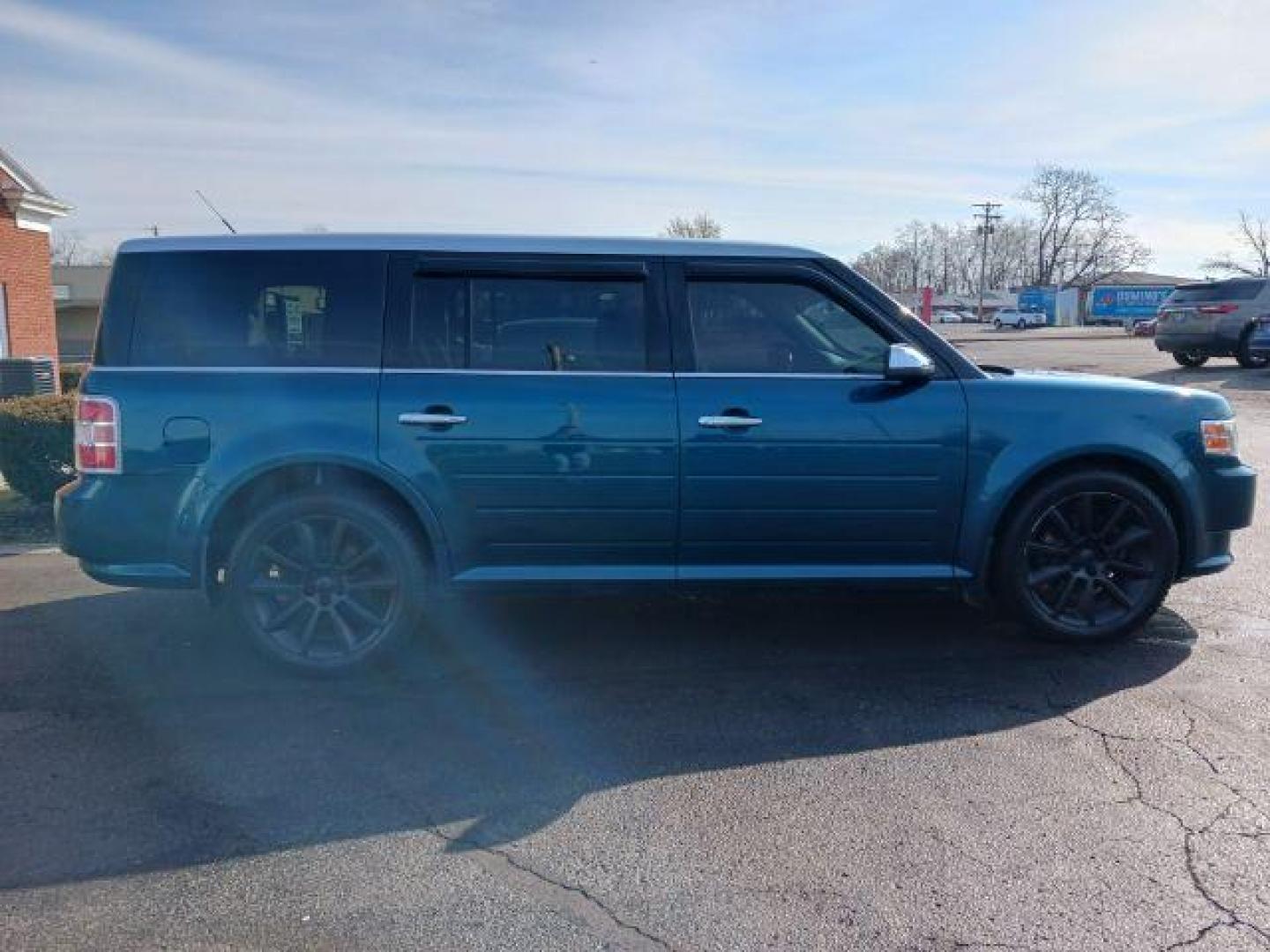 2011 Earth Metallic Ford Flex Limited AWD (2FMHK6DC9BB) with an 3.5L V6 DOHC 24V engine, 6-Speed Automatic Overdrive transmission, located at 1099 N County Rd 25A , Troy, OH, 45373, (937) 908-9800, 40.057079, -84.212883 - Photo#4