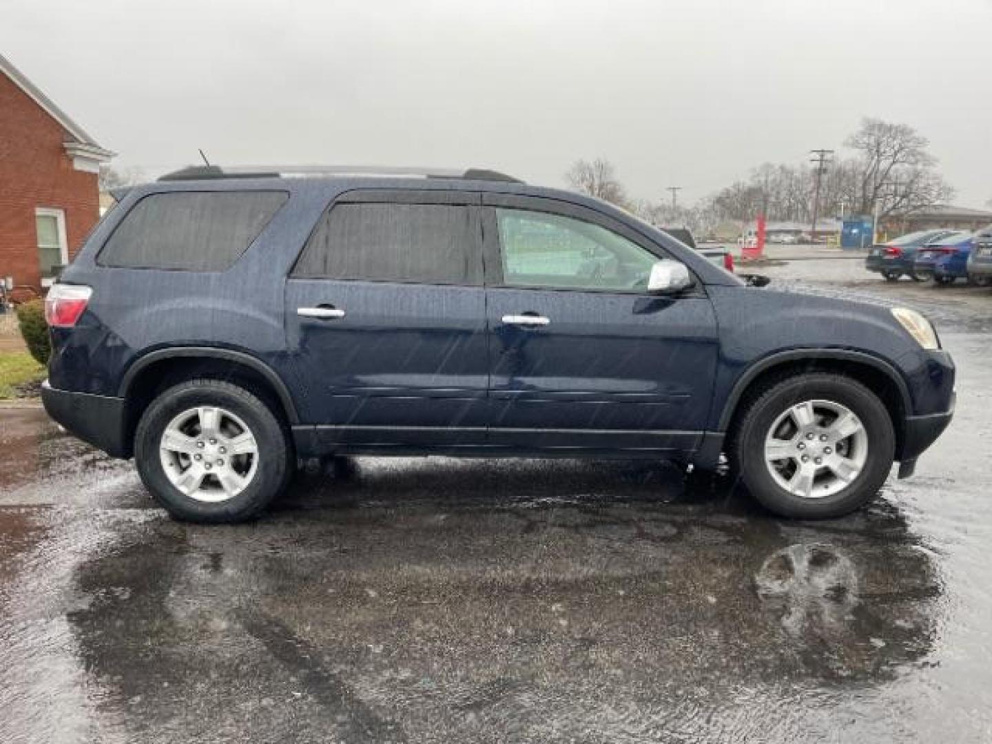 2011 Dark Blue Metallic GMC Acadia SLE-1 AWD (1GKKVNED3BJ) with an 3.6L V6 DOHC 24V engine, 6-Speed Automatic transmission, located at 880 E. National Road, Vandalia, OH, 45377, (937) 908-9800, 39.891918, -84.183594 - Photo#4