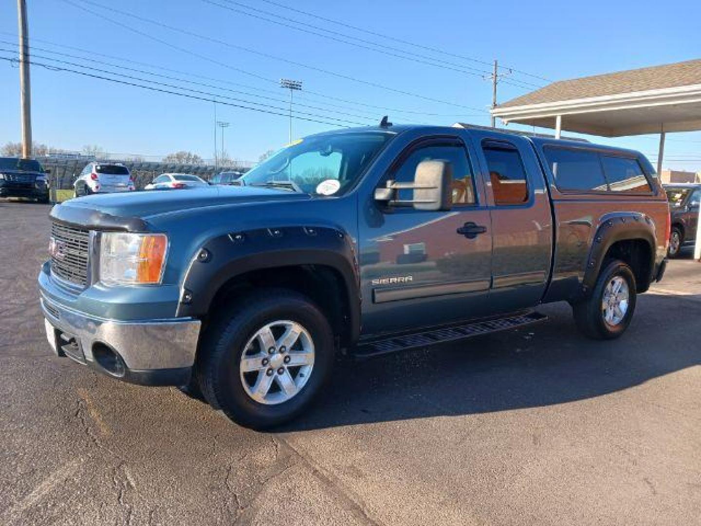 2011 Midnight Blue Metallic GMC Sierra 1500 SLE Ext. Cab 4WD (1GTR2VE32BZ) with an 5.3L V8 OHV 16V FFV engine, 6-Speed Automatic transmission, located at 1184 Kauffman Ave, Fairborn, OH, 45324, (937) 908-9800, 39.807072, -84.030914 - Photo#2