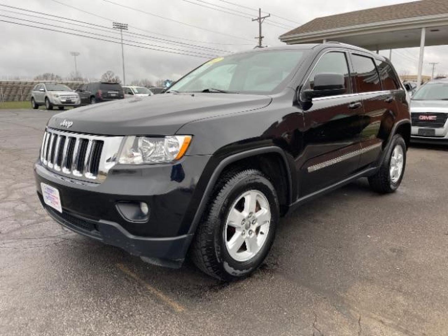 2011 Brilliant Black Crystal Pearl Jeep Grand Cherokee Laredo 4WD (1J4RR4GG4BC) with an 3.6L V6 DOHC 24V engine, 5-Speed Automatic transmission, located at 880 E. National Road, Vandalia, OH, 45377, (937) 908-9800, 39.891918, -84.183594 - Photo#1