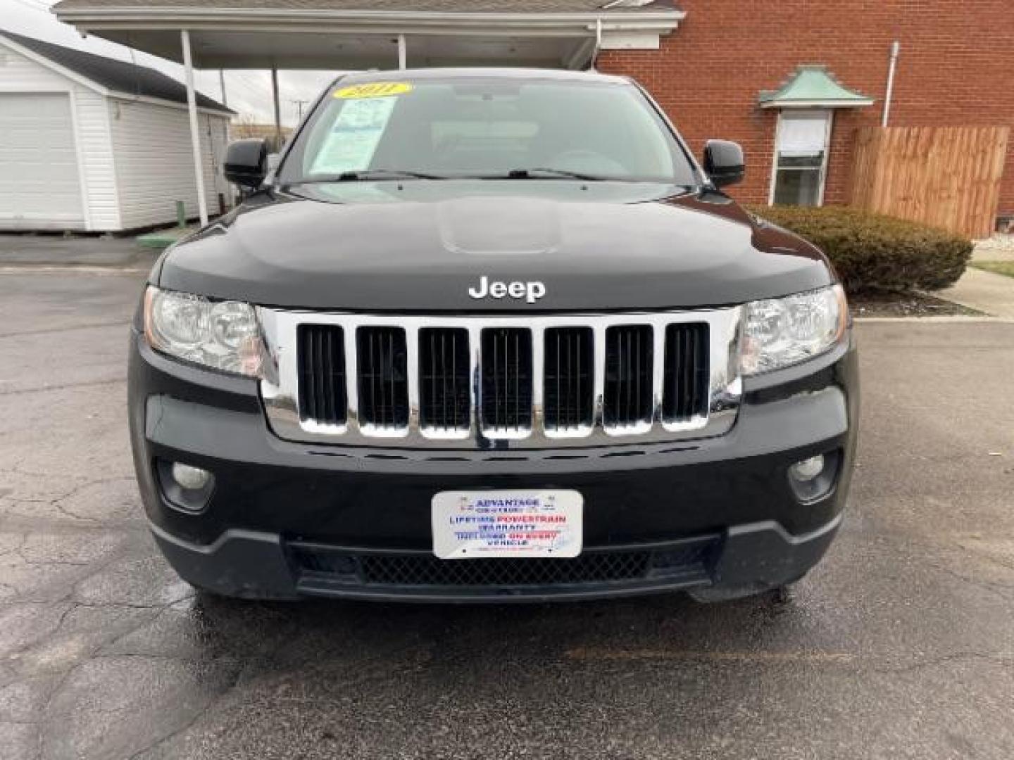 2011 Brilliant Black Crystal Pearl Jeep Grand Cherokee Laredo 4WD (1J4RR4GG4BC) with an 3.6L V6 DOHC 24V engine, 5-Speed Automatic transmission, located at 880 E. National Road, Vandalia, OH, 45377, (937) 908-9800, 39.891918, -84.183594 - Photo#5