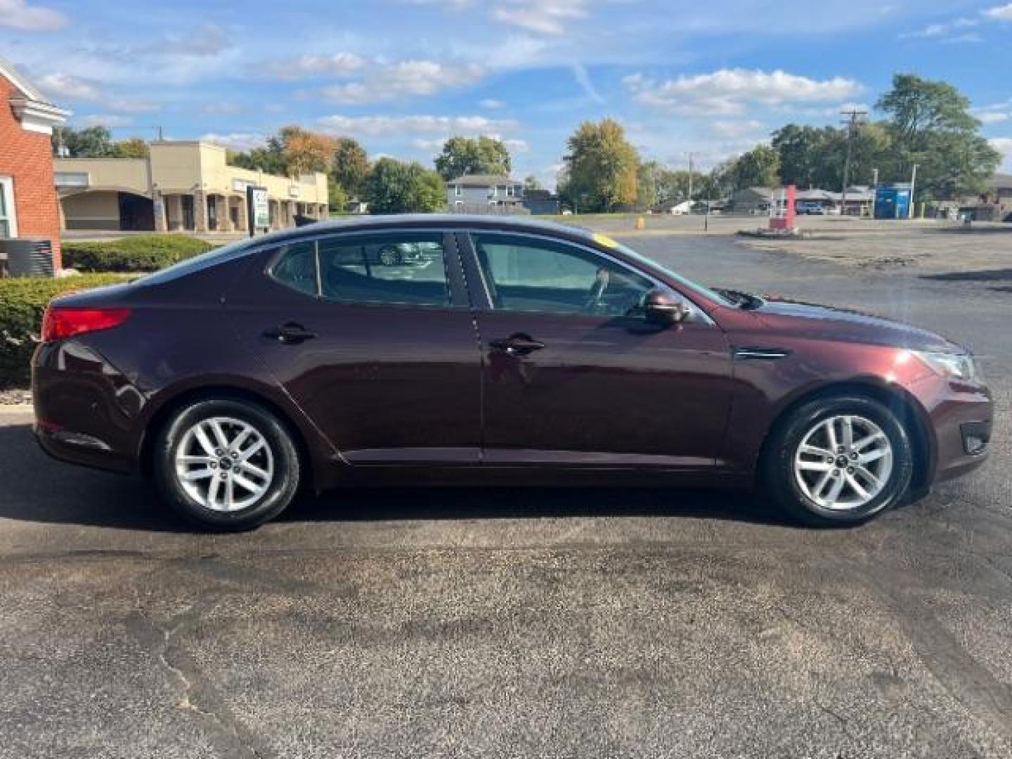 2011 Dark Cherry Kia Optima LX AT (KNAGM4A72B5) with an 2.4L L4 DOHC 16V engine, 6-Speed Automatic transmission, located at 1951 S Dayton Lakeview Rd., New Carlisle, OH, 45344, (937) 908-9800, 39.890999, -84.050255 - Photo#5