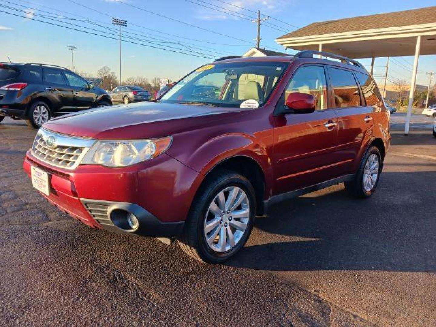 2011 Camellia Red Pearl Subaru Forester 2.5X Limited (JF2SHAEC2BH) with an 2.5L H4 SOHC 16V engine, 4-Speed Automatic transmission, located at 1230 East Main St, Xenia, OH, 45385, (937) 908-9800, 39.688026, -83.910172 - Photo#2