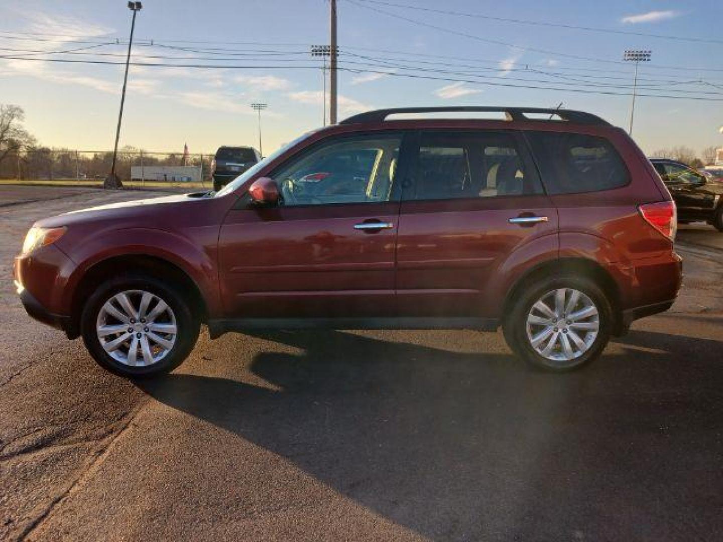 2011 Camellia Red Pearl Subaru Forester 2.5X Limited (JF2SHAEC2BH) with an 2.5L H4 SOHC 16V engine, 4-Speed Automatic transmission, located at 1230 East Main St, Xenia, OH, 45385, (937) 908-9800, 39.688026, -83.910172 - Photo#3