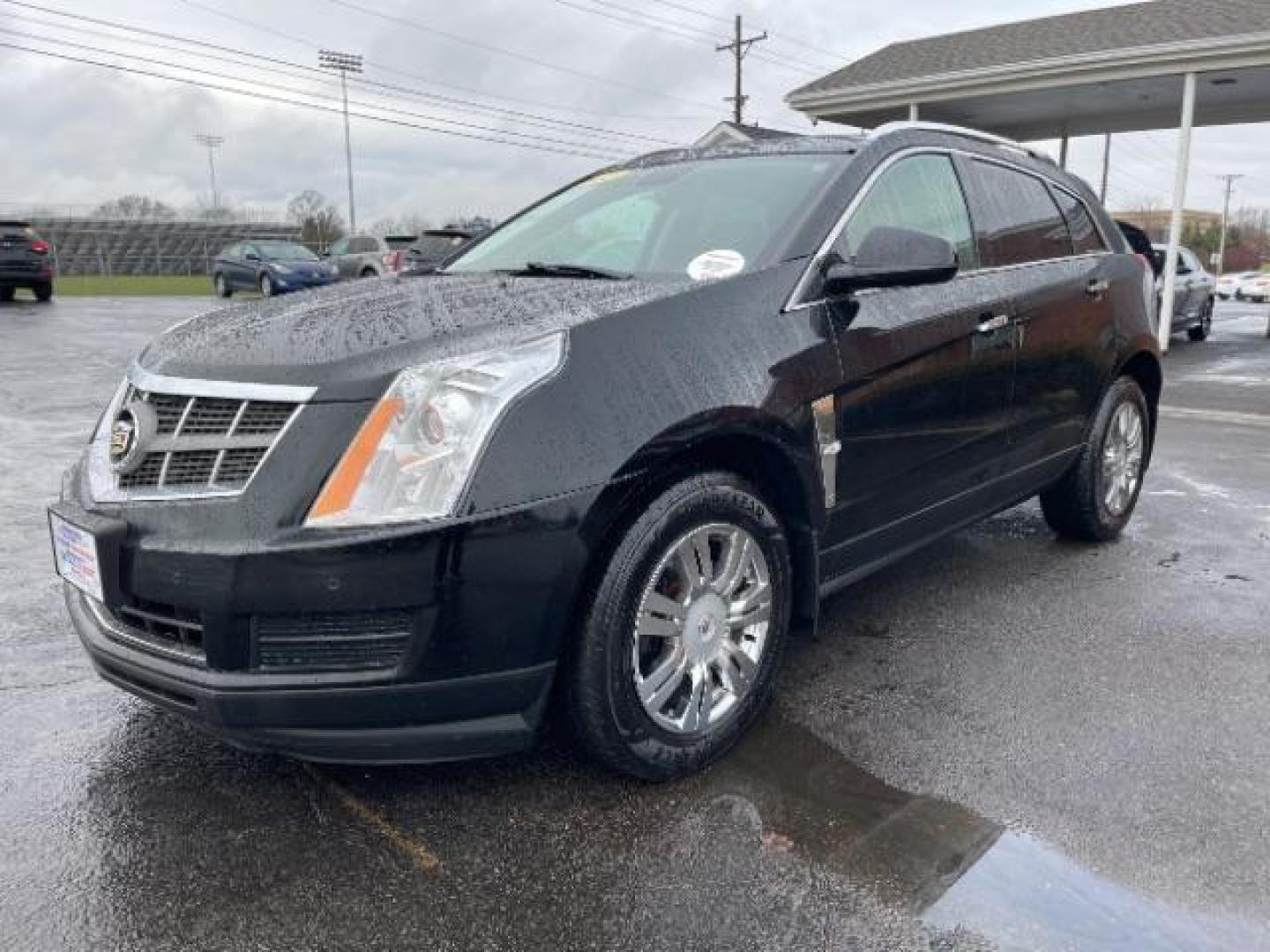 2012 Black Raven Cadillac SRX Luxury AWD (3GYFNDE35CS) with an 3.6L V6 DOHC 24V FFV engine, 6-Speed Automatic transmission, located at 1184 Kauffman Ave, Fairborn, OH, 45324, (937) 908-9800, 39.807072, -84.030914 - Photo#1