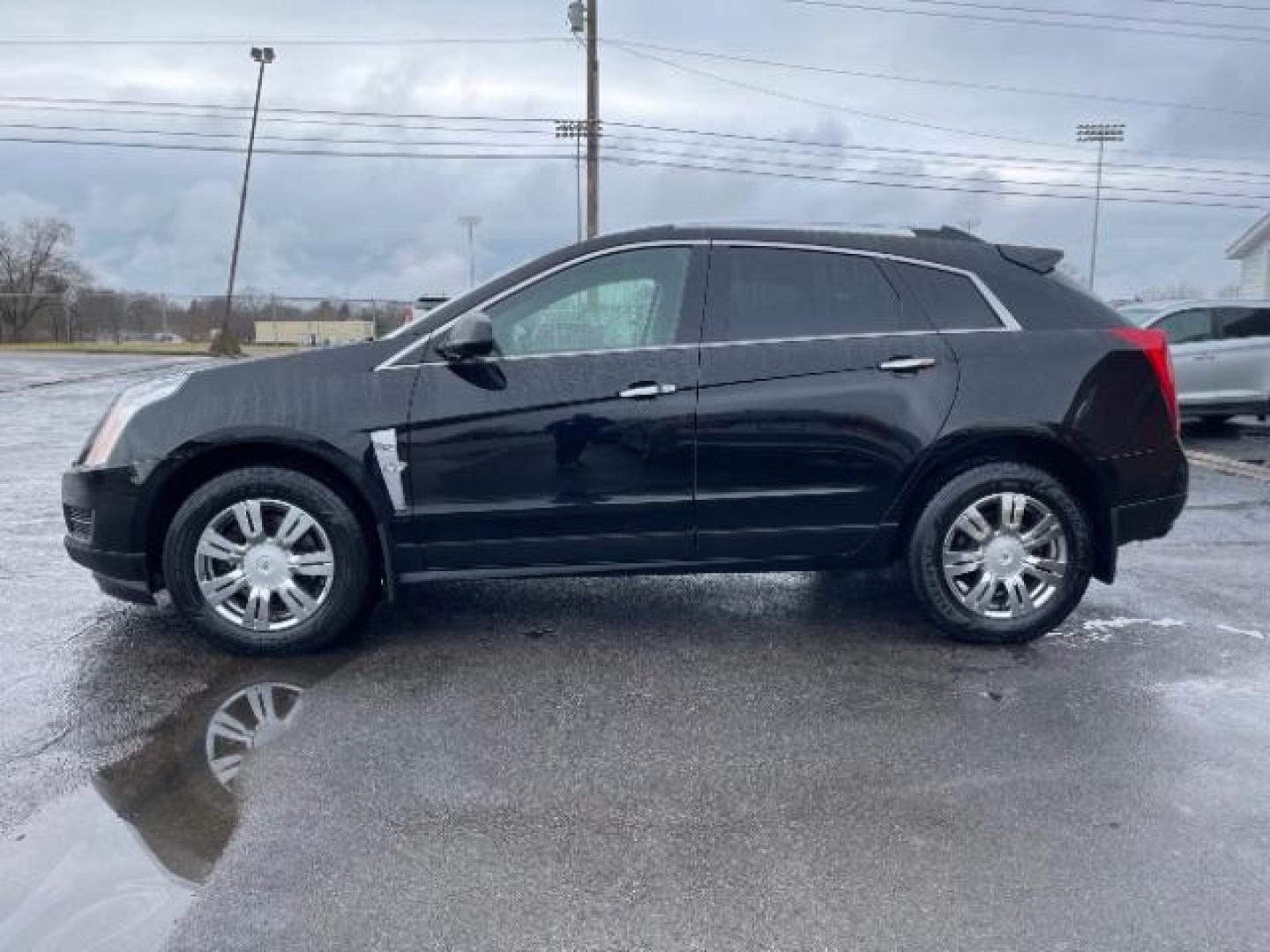 2012 Black Raven Cadillac SRX Luxury AWD (3GYFNDE35CS) with an 3.6L V6 DOHC 24V FFV engine, 6-Speed Automatic transmission, located at 1184 Kauffman Ave, Fairborn, OH, 45324, (937) 908-9800, 39.807072, -84.030914 - Photo#2