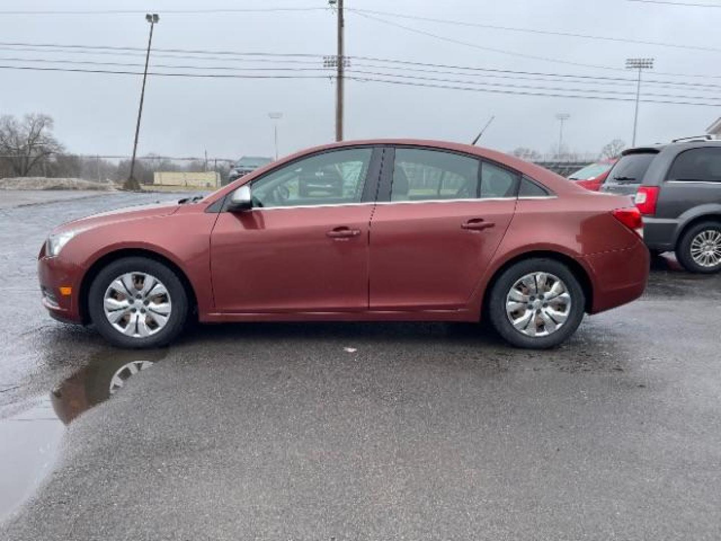 2012 Orange Chevrolet Cruze 2LS (1G1PC5SH1C7) with an 1.8L L4 DOHC 16V FFV engine, 6-Speed Automatic transmission, located at 4508 South Dixie Dr, Moraine, OH, 45439, (937) 908-9800, 39.689976, -84.218452 - Photo#4