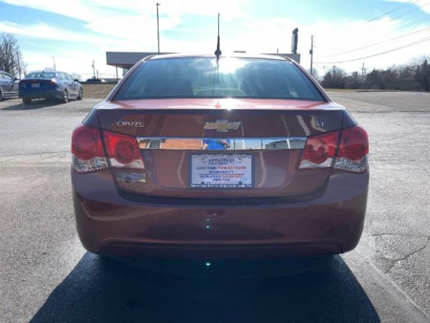 2012 Orange Chevrolet Cruze 1LT (1G1PF5SC6C7) with an 1.4L L4 DOHC 16V TURBO engine, 6-Speed Automatic transmission, located at 4508 South Dixie Dr, Moraine, OH, 45439, (937) 908-9800, 39.689976, -84.218452 - Photo#5