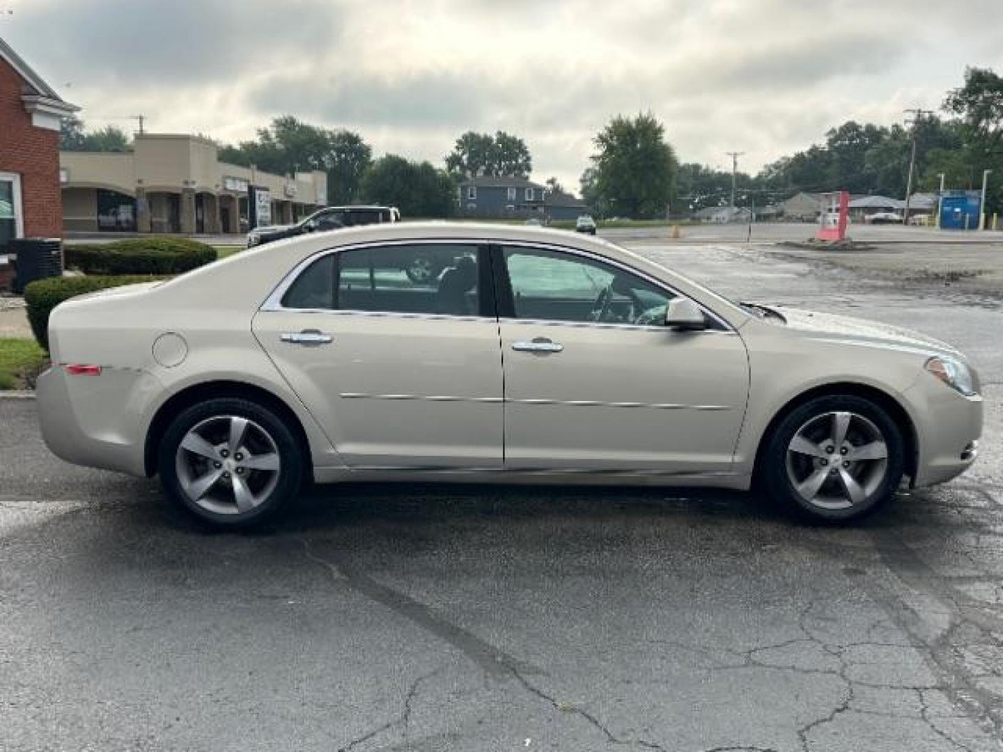 2012 Gold Mist Metallic Chevrolet Malibu 1LT (1G1ZC5E07CF) with an 2.4L L4 DOHC 16V engine, 6-Speed Automatic transmission, located at 1099 N County Rd 25A , Troy, OH, 45373, (937) 908-9800, 40.057079, -84.212883 - Photo#5