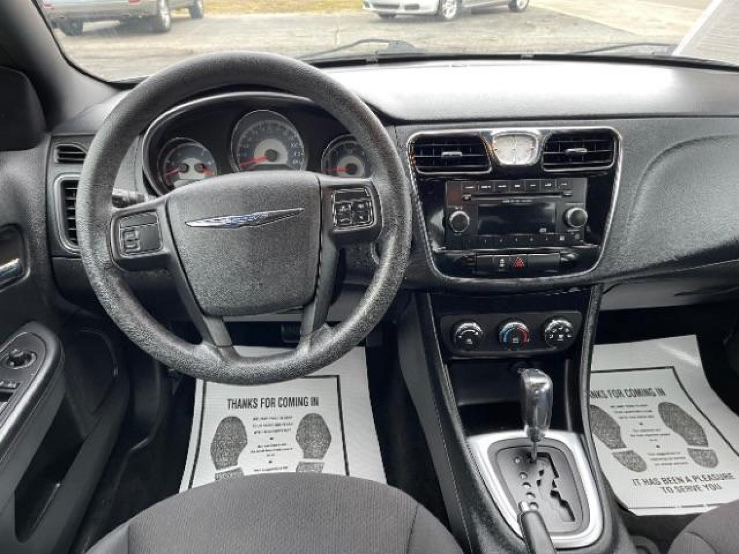 2012 Black Chrysler 200 LX (1C3CCBAB4CN) with an 2.4L L4 DOHC 16V engine, 6-Speed Automatic transmission, located at 880 E. National Road, Vandalia, OH, 45377, (937) 908-9800, 39.891918, -84.183594 - Photo#7