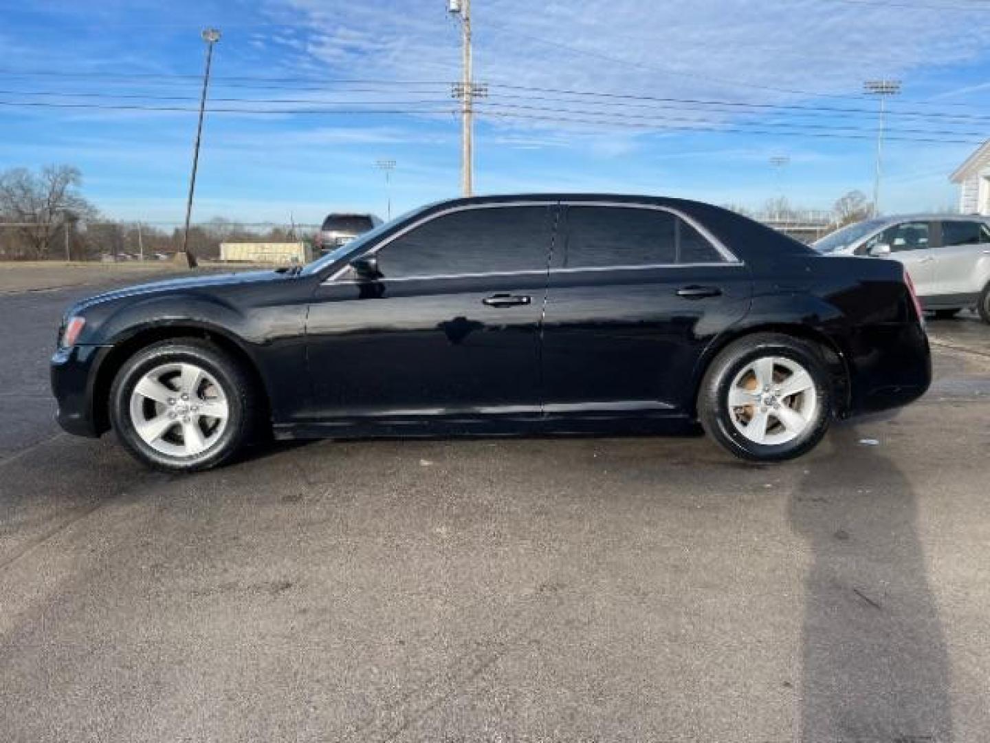 2012 Gloss Black Chrysler 300 Base (2C3CCAAG2CH) with an 3.6L V6 SOHC 24V engine, 5-Speed Automatic transmission, located at 401 Woodman Dr, Riverside, OH, 45431, (937) 908-9800, 39.760899, -84.123421 - Photo#3