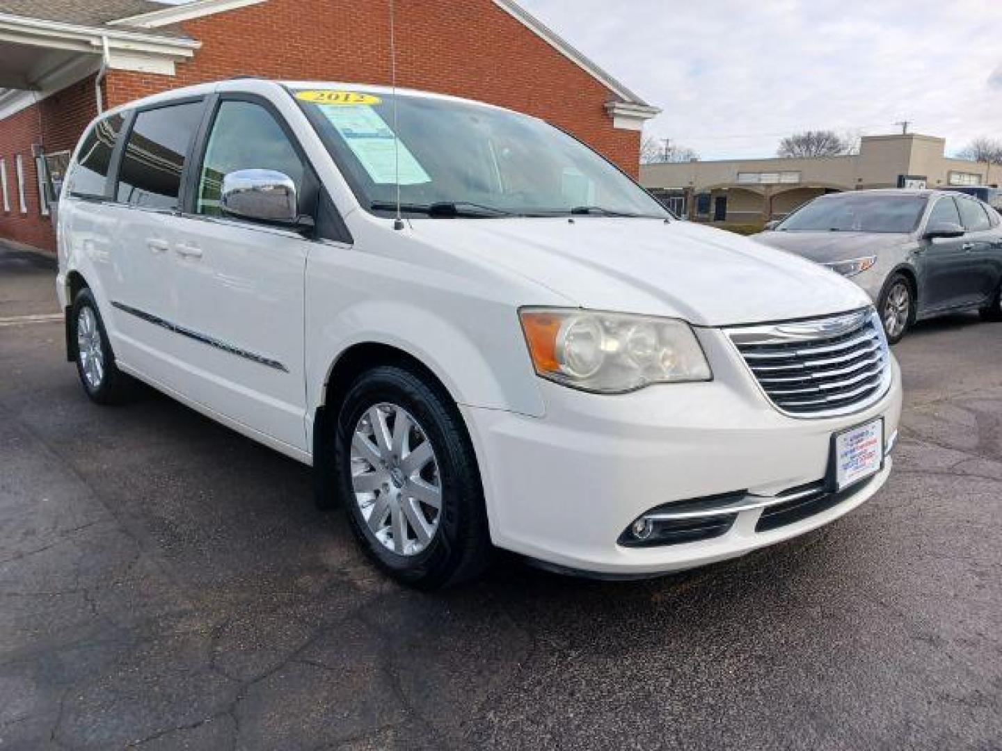 2012 Stone White Chrysler Town and Country Touring-L (2C4RC1CG4CR) with an 3.6L V6 DOHC 24V engine, 6-Speed Automatic transmission, located at 1099 N County Rd 25A , Troy, OH, 45373, (937) 908-9800, 40.057079, -84.212883 - Photo#0