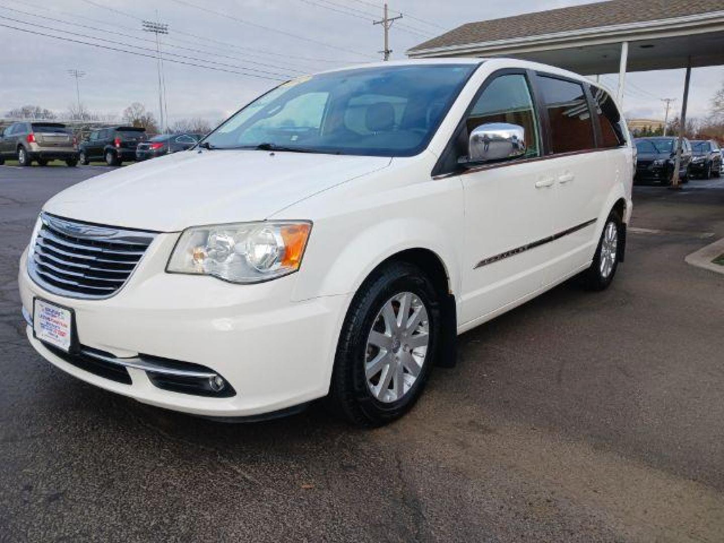 2012 Stone White Chrysler Town and Country Touring-L (2C4RC1CG4CR) with an 3.6L V6 DOHC 24V engine, 6-Speed Automatic transmission, located at 1099 N County Rd 25A , Troy, OH, 45373, (937) 908-9800, 40.057079, -84.212883 - Photo#2