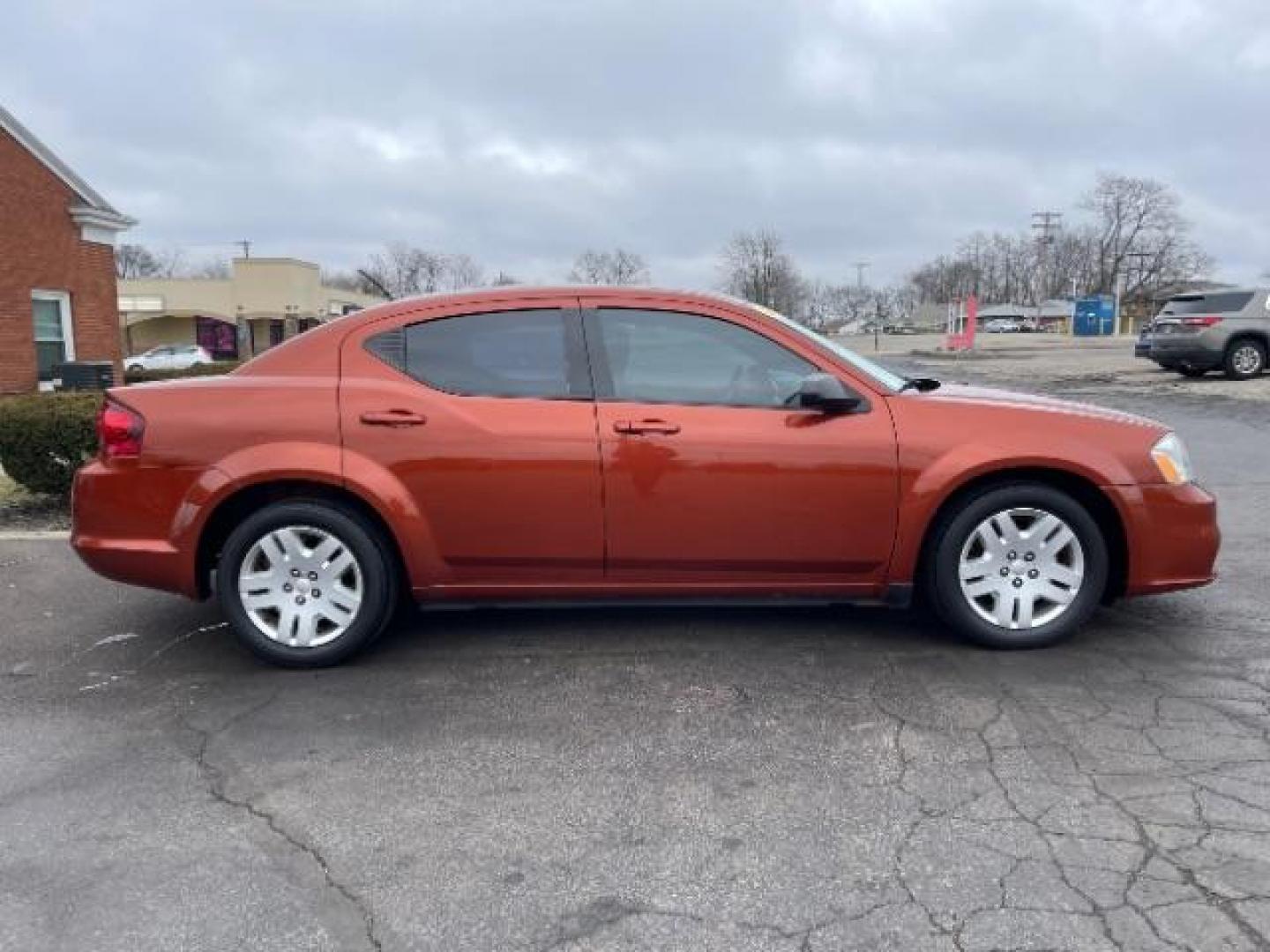 2012 Orange Dodge Avenger Base (1C3CDZAB1CN) with an 2.4L L4 DOHC 16V engine, 4-Speed Automatic transmission, located at 4508 South Dixie Dr, Moraine, OH, 45439, (937) 908-9800, 39.689976, -84.218452 - Photo#3