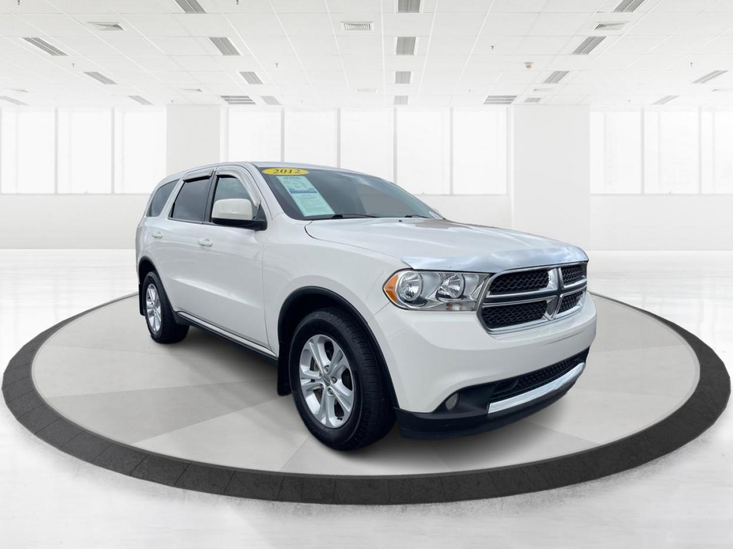 2012 White Gold Dodge Durango SXT AWD (1C4RDJAGXCC) with an 3.6L V6 DOHC 24V engine, 5-Speed Automatic transmission, located at 1184 Kauffman Ave, Fairborn, OH, 45324, (937) 908-9800, 39.807072, -84.030914 - Photo#0