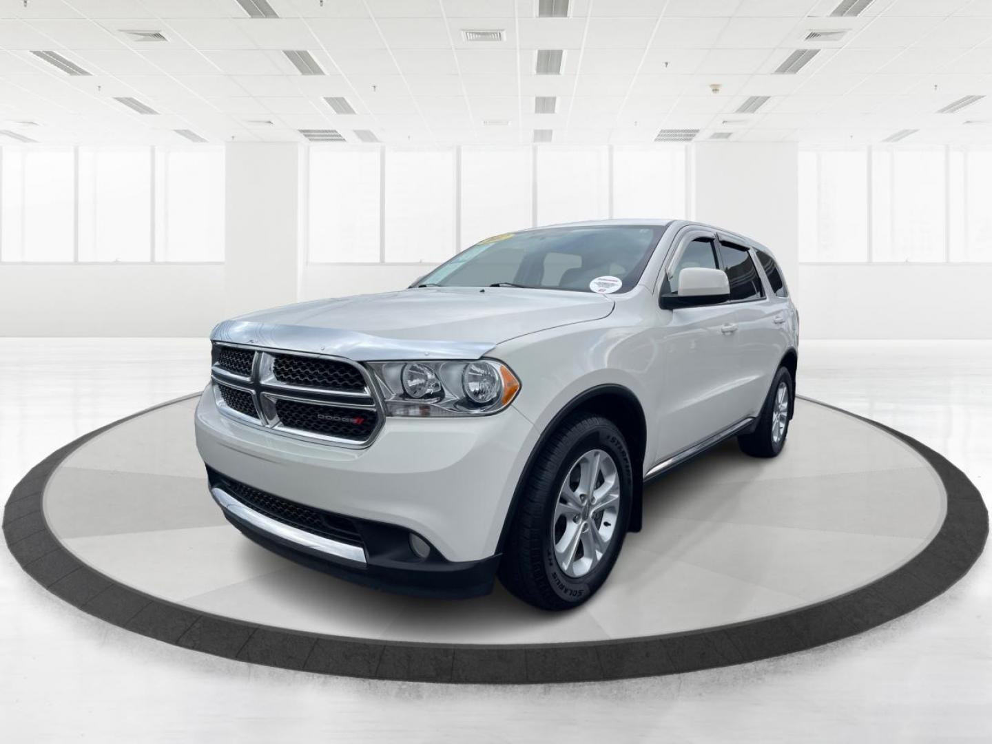 2012 White Gold Dodge Durango SXT AWD (1C4RDJAGXCC) with an 3.6L V6 DOHC 24V engine, 5-Speed Automatic transmission, located at 1184 Kauffman Ave, Fairborn, OH, 45324, (937) 908-9800, 39.807072, -84.030914 - Photo#7