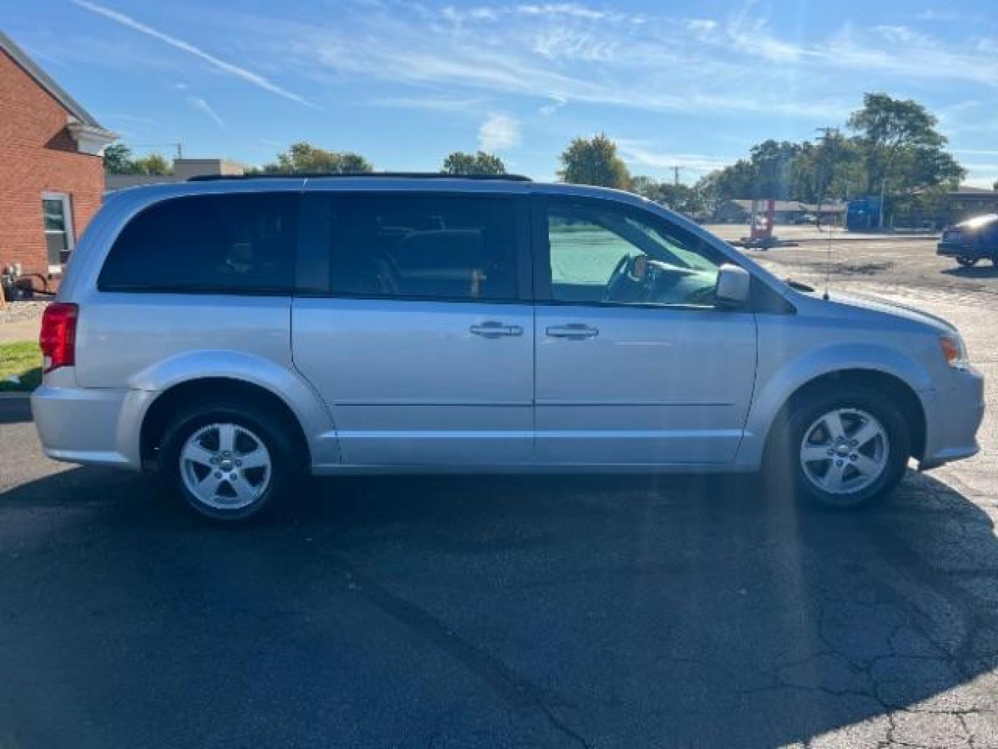 2012 Bright Silver Metallic Dodge Grand Caravan SXT (2C4RDGCG8CR) with an 3.6L V6 DOHC 24V engine, 6-Speed Automatic transmission, located at 880 E. National Road, Vandalia, OH, 45377, (937) 908-9800, 39.891918, -84.183594 - Photo#5