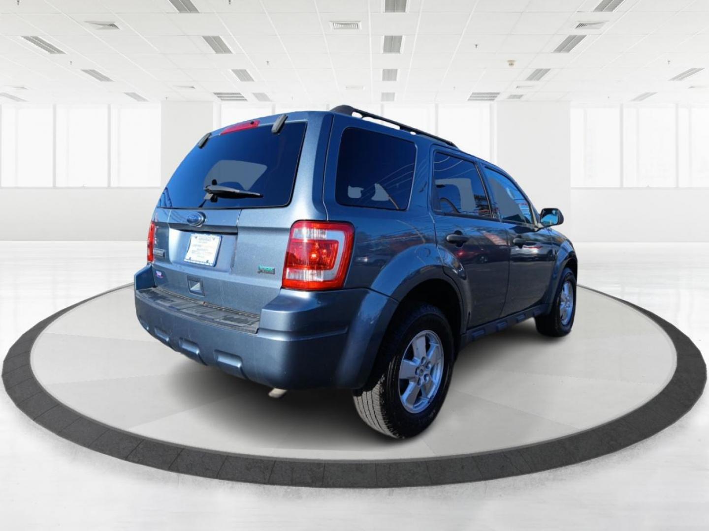 2012 Blue Flame Metallic Ford Escape XLT FWD (1FMCU0DG1CK) with an 3.0L V6 DOHC 24V engine, 6-Speed Automatic transmission, located at 1184 Kauffman Ave, Fairborn, OH, 45324, (937) 908-9800, 39.807072, -84.030914 - Photo#2