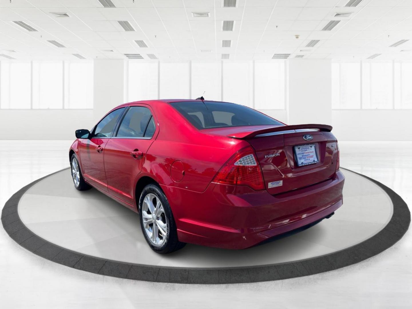 2012 Red Candy Metallic Ford Fusion (3FAHP0HA5CR) with an 2.5L L4 DOHC 16V engine, located at 1184 Kauffman Ave, Fairborn, OH, 45324, (937) 908-9800, 39.807072, -84.030914 - Photo#4