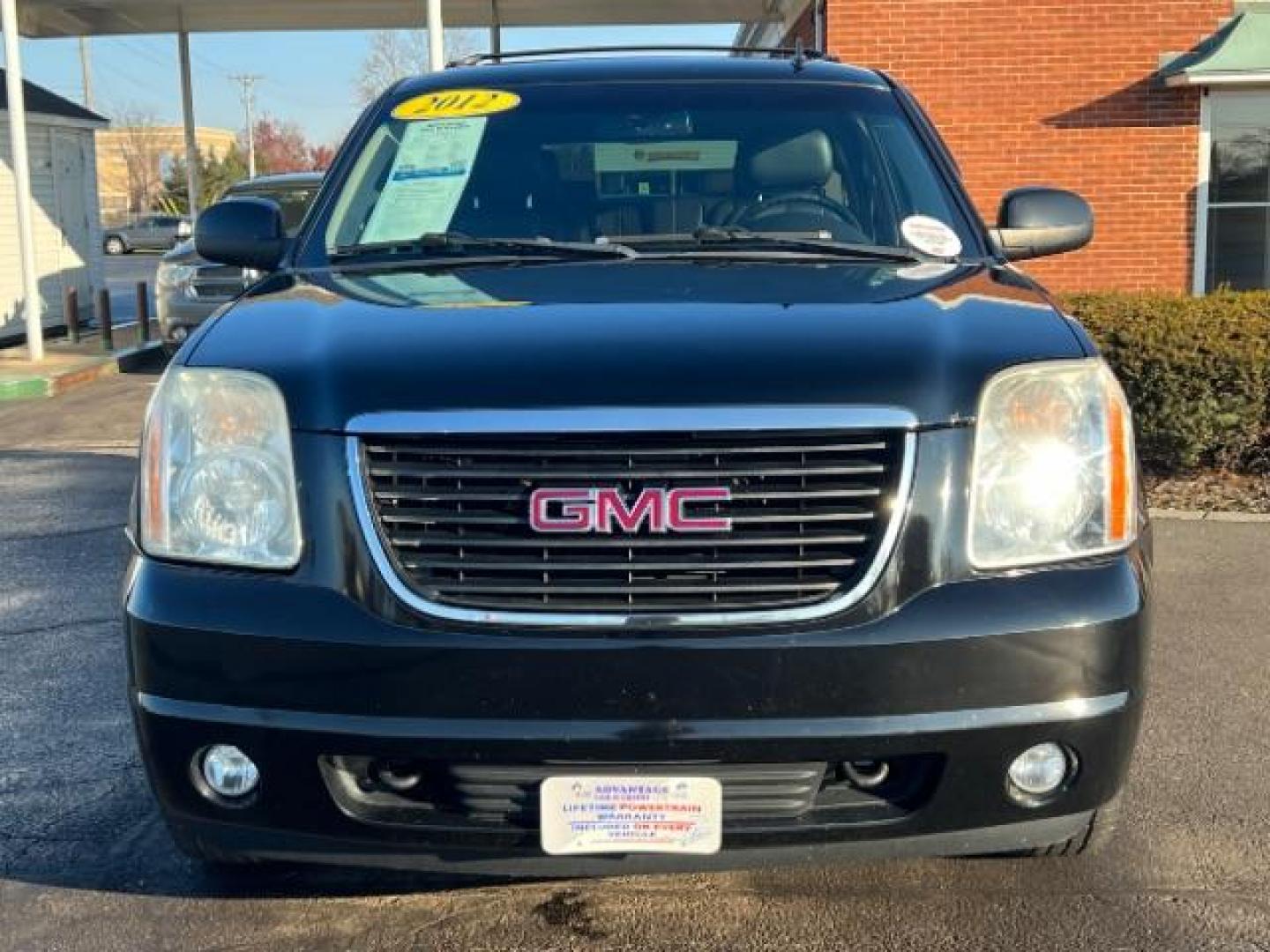 2012 Onyx Black GMC Yukon SLT1 4WD (1GKS2CE03CR) with an 5.3L V8 OHV 16V FFV engine, 6-Speed Automatic transmission, located at 1951 S Dayton Lakeview Rd., New Carlisle, OH, 45344, (937) 908-9800, 39.890999, -84.050255 - Photo#1