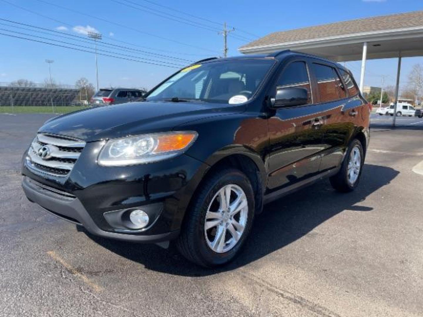 2012 Twilight Black Hyundai Santa Fe Limited 2.4 FWD (5XYZK3AB2CG) with an 2.4L L4 DOHC 16V engine, 6-Speed Automatic transmission, located at 880 E. National Road, Vandalia, OH, 45377, (937) 908-9800, 39.891918, -84.183594 - Photo#1