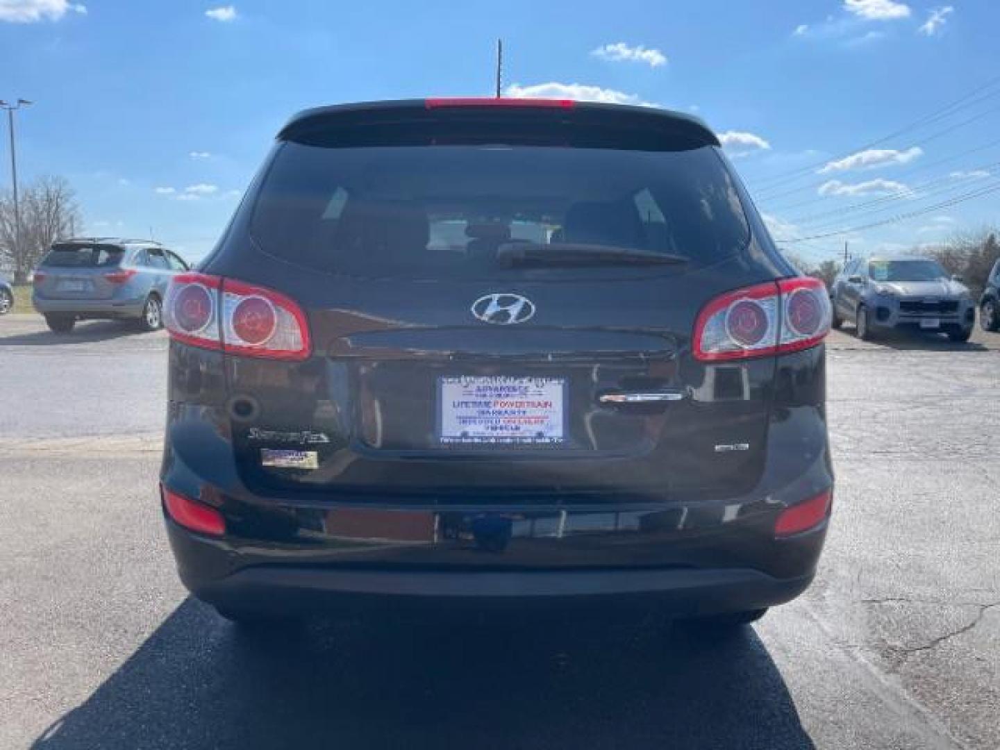 2012 Twilight Black Hyundai Santa Fe Limited 2.4 FWD (5XYZK3AB2CG) with an 2.4L L4 DOHC 16V engine, 6-Speed Automatic transmission, located at 880 E. National Road, Vandalia, OH, 45377, (937) 908-9800, 39.891918, -84.183594 - Photo#5