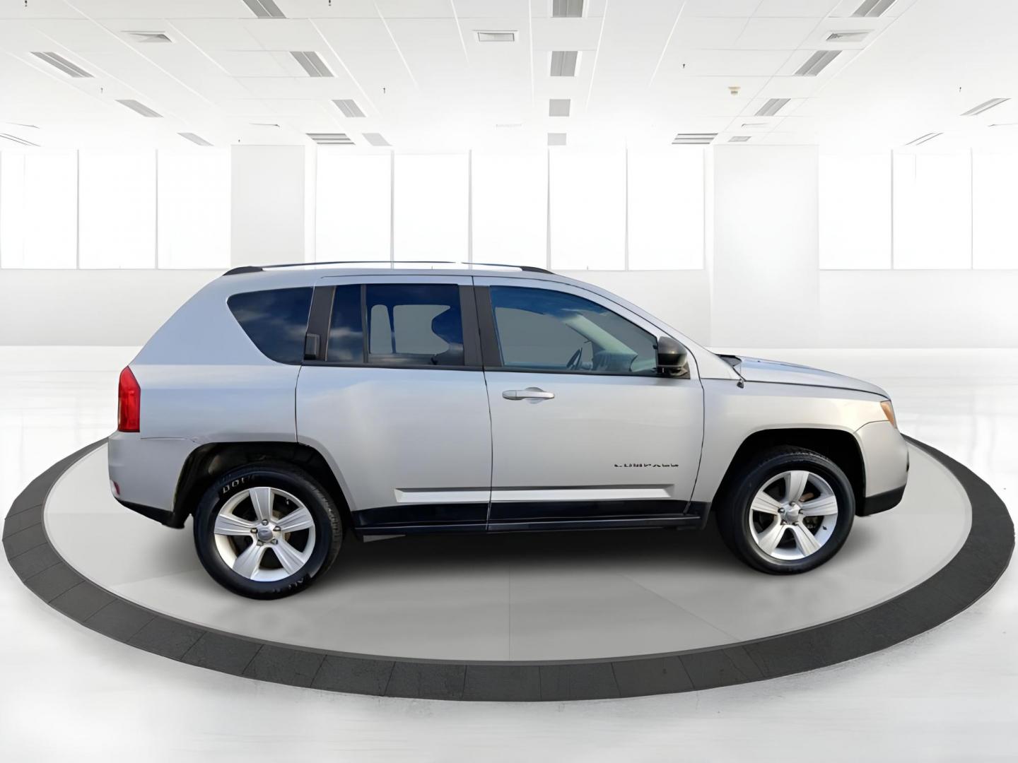 2012 Bright Silver Metallic Jeep Compass Sport 4WD (1C4NJDBB6CD) with an 2.4L L4 DOHC 16V engine, located at 401 Woodman Dr, Riverside, OH, 45431, (937) 908-9800, 39.760899, -84.123421 - Photo#1