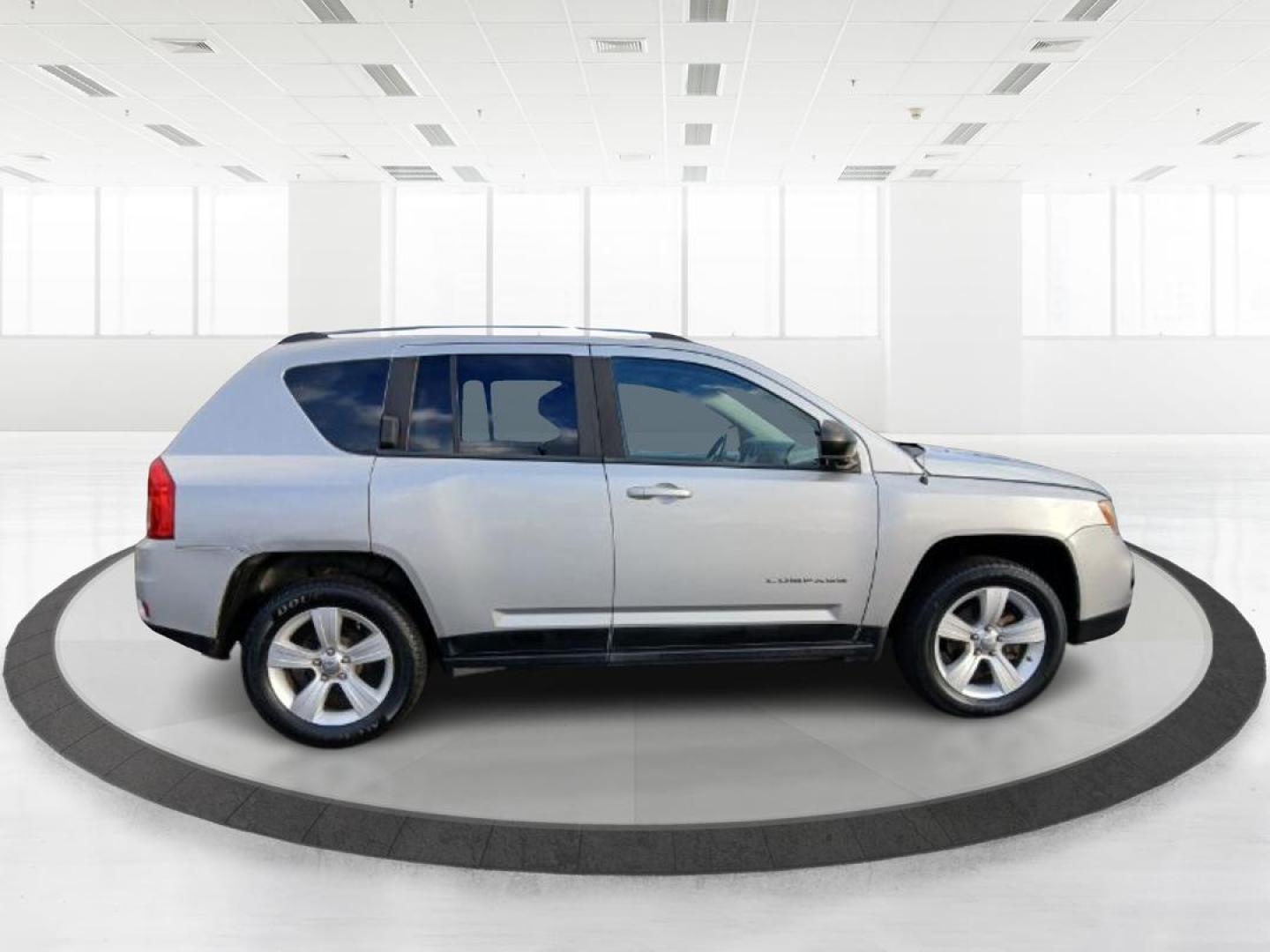 2012 Bright Silver Metallic Jeep Compass Sport 4WD (1C4NJDBB6CD) with an 2.4L L4 DOHC 16V engine, located at 1951 S Dayton Lakeview Rd., New Carlisle, OH, 45344, (937) 908-9800, 39.890999, -84.050255 - 2012 Jeep Compass Sport 4WD - Photo#1