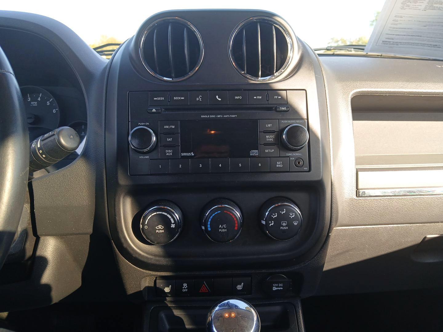 2012 Black Jeep Compass Latitude FWD (1C4NJCEB7CD) with an 2.4L L4 DOHC 16V engine, Continuously Variable Transmission transmission, located at 8750 N County Rd 25A, Piqua, OH, 45356, (937) 908-9800, 40.164391, -84.232513 - Photo#12