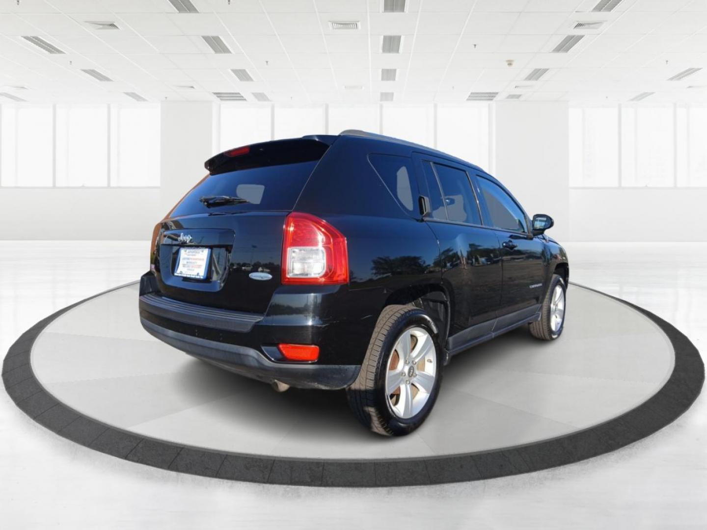 2012 Black Jeep Compass Latitude FWD (1C4NJCEB7CD) with an 2.4L L4 DOHC 16V engine, Continuously Variable Transmission transmission, located at 8750 N County Rd 25A, Piqua, OH, 45356, (937) 908-9800, 40.164391, -84.232513 - Photo#2