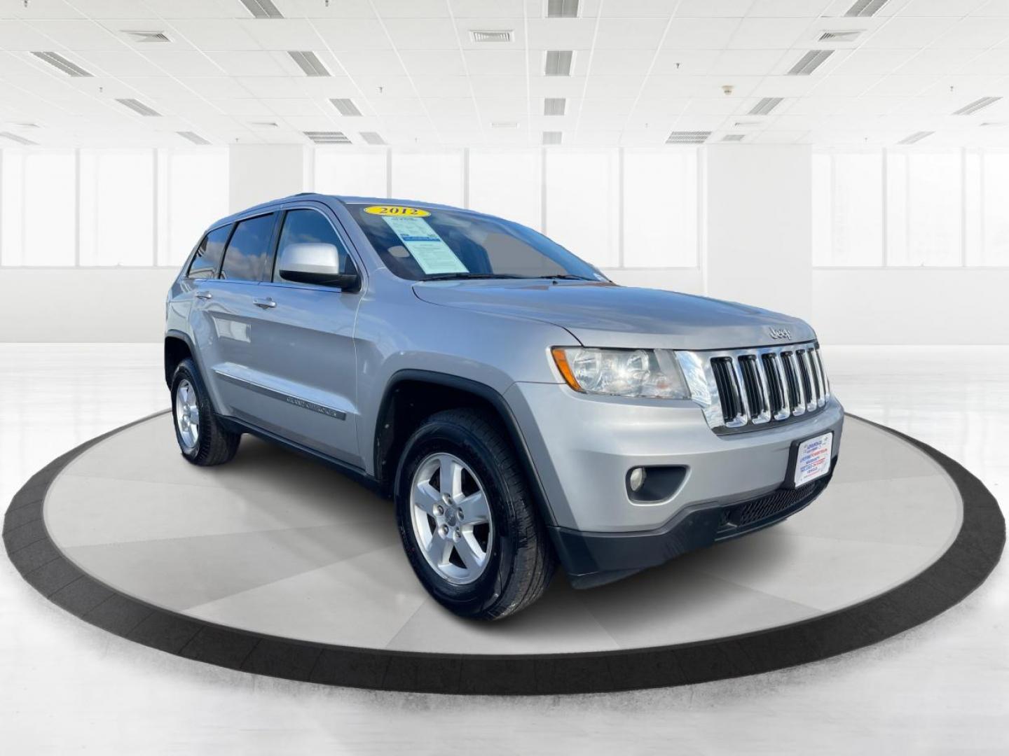 2012 Jeep Grand Cherokee Laredo 4WD (1C4RJFAG2CC) with an 3.6L V6 DOHC 24V engine, 5-Speed Automatic transmission, located at 8750 N County Rd 25A, Piqua, OH, 45356, (937) 908-9800, 40.164391, -84.232513 - 2012 Jeep Grand Cherokee Laredo 4WD - Photo#0