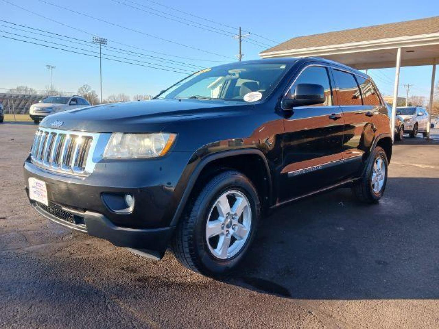 2012 Brilliant Black Crystal Pearl Jeep Grand Cherokee Laredo 4WD (1C4RJFAG1CC) with an 3.6L V6 DOHC 24V engine, 5-Speed Automatic transmission, located at 1099 N County Rd 25A , Troy, OH, 45373, (937) 908-9800, 40.057079, -84.212883 - Photo#2