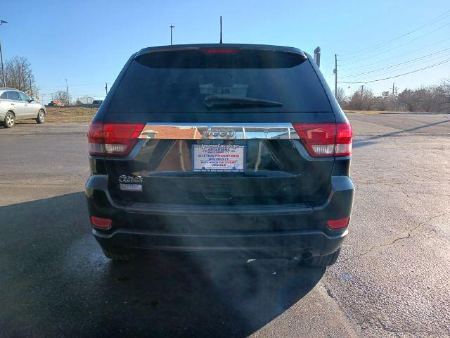 2012 Brilliant Black Crystal Pearl Jeep Grand Cherokee Laredo 4WD (1C4RJFAG1CC) with an 3.6L V6 DOHC 24V engine, 5-Speed Automatic transmission, located at 1099 N County Rd 25A , Troy, OH, 45373, (937) 908-9800, 40.057079, -84.212883 - Photo#5