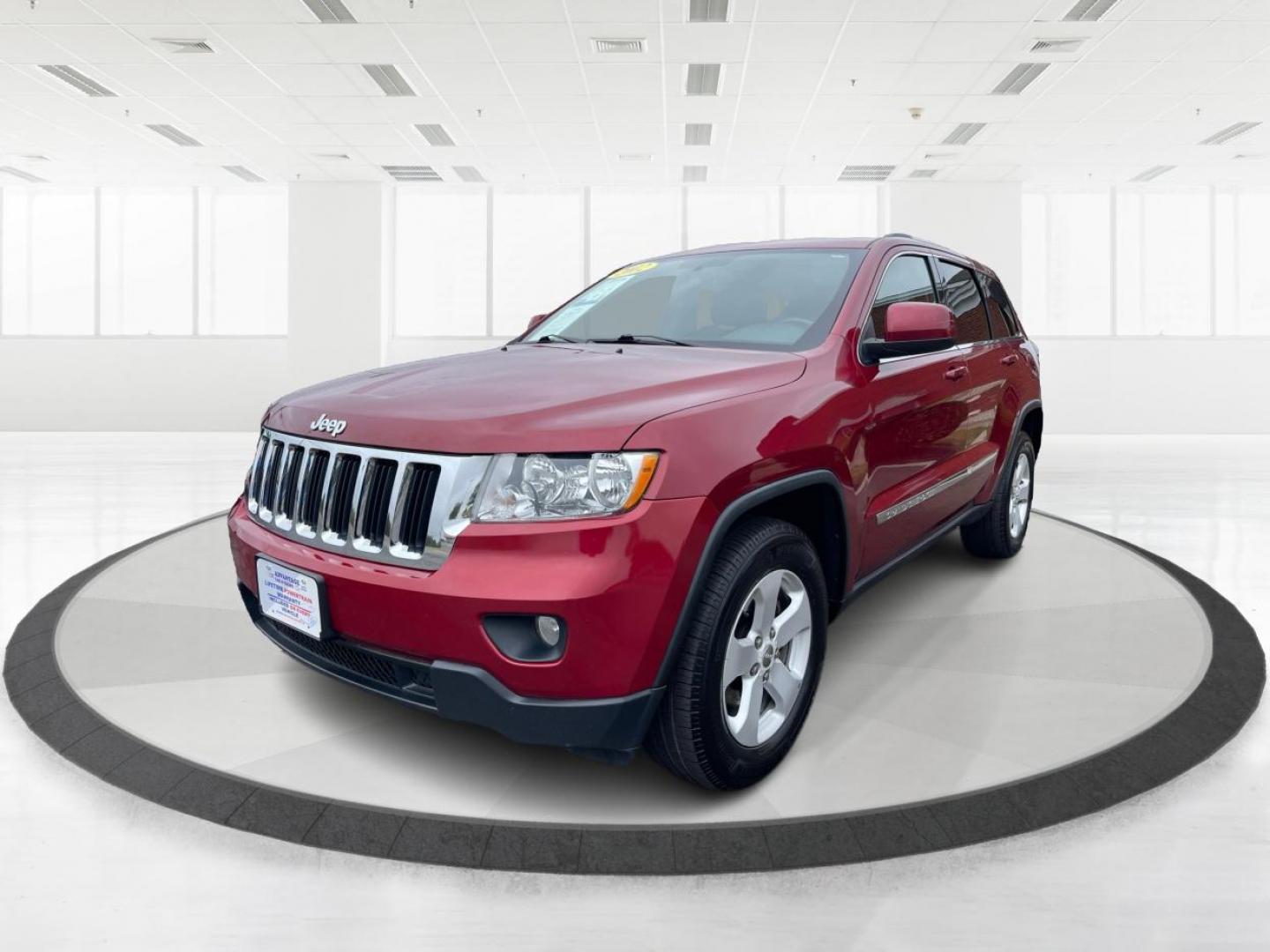 2012 Deep Cherry Red Crystal Pearl Jeep Grand Cherokee Laredo 4WD (1C4RJFAG6CC) with an 3.6L V6 DOHC 24V engine, 5-Speed Automatic transmission, located at 1230 East Main St, Xenia, OH, 45385, (937) 908-9800, 39.688026, -83.910172 - Photo#7