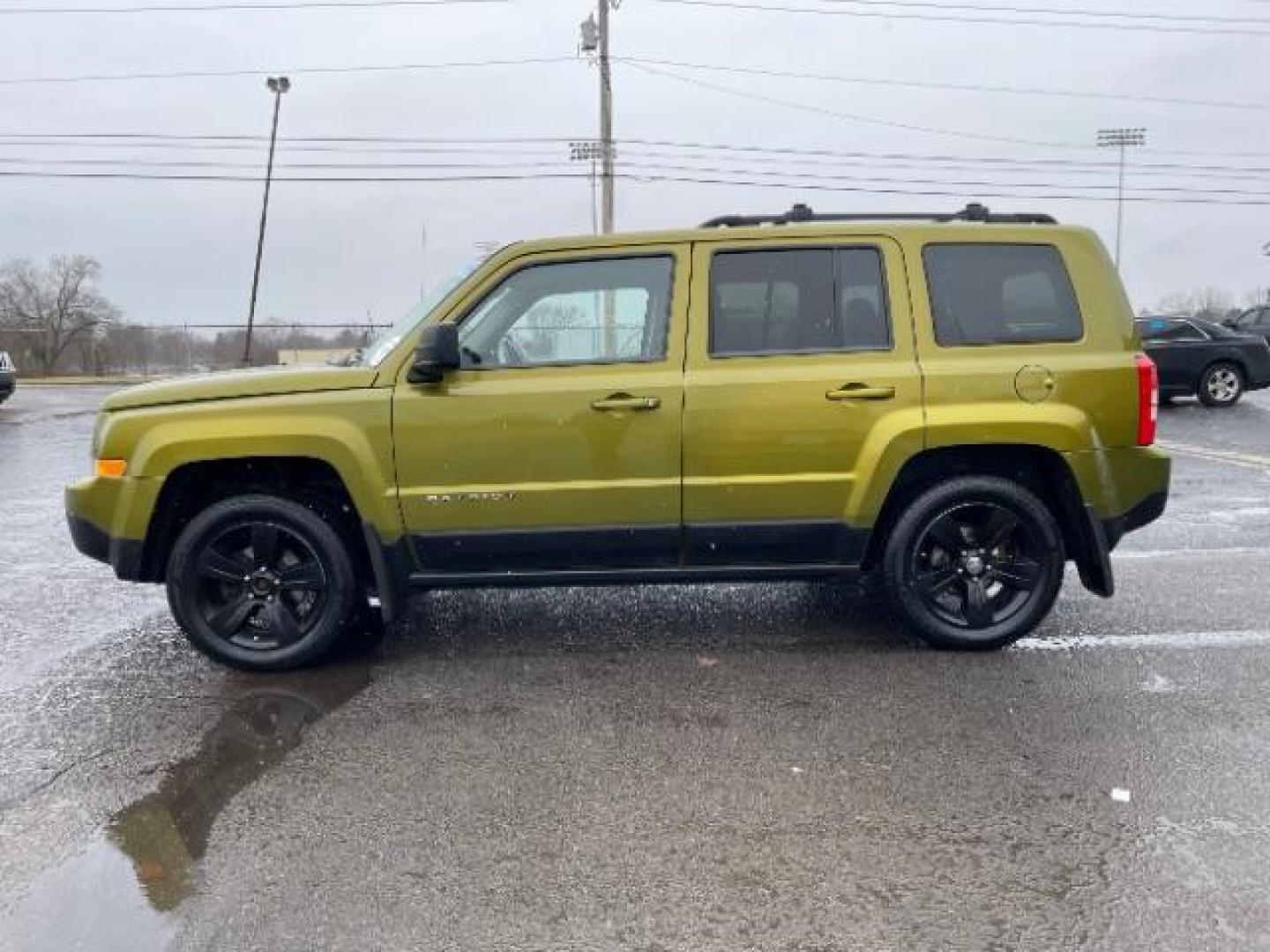 2012 Rescue Green Metallic Jeep Patriot Latitude 4WD (1C4NJRFB8CD) with an 2.4L L4 DOHC 16V engine, located at 1951 S Dayton Lakeview Rd., New Carlisle, OH, 45344, (937) 908-9800, 39.890999, -84.050255 - Photo#2