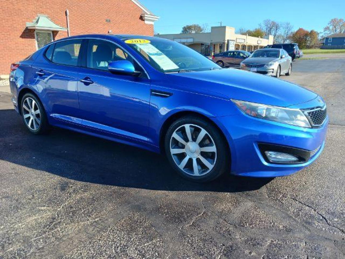 2012 Corsa Blue Pearl Metallic Kia Optima SX (5XXGR4A67CG) with an 2.0L L4 DOHC 16V TURBO engine, 6-Speed Automatic transmission, located at 1184 Kauffman Ave, Fairborn, OH, 45324, (937) 908-9800, 39.807072, -84.030914 - Photo#0