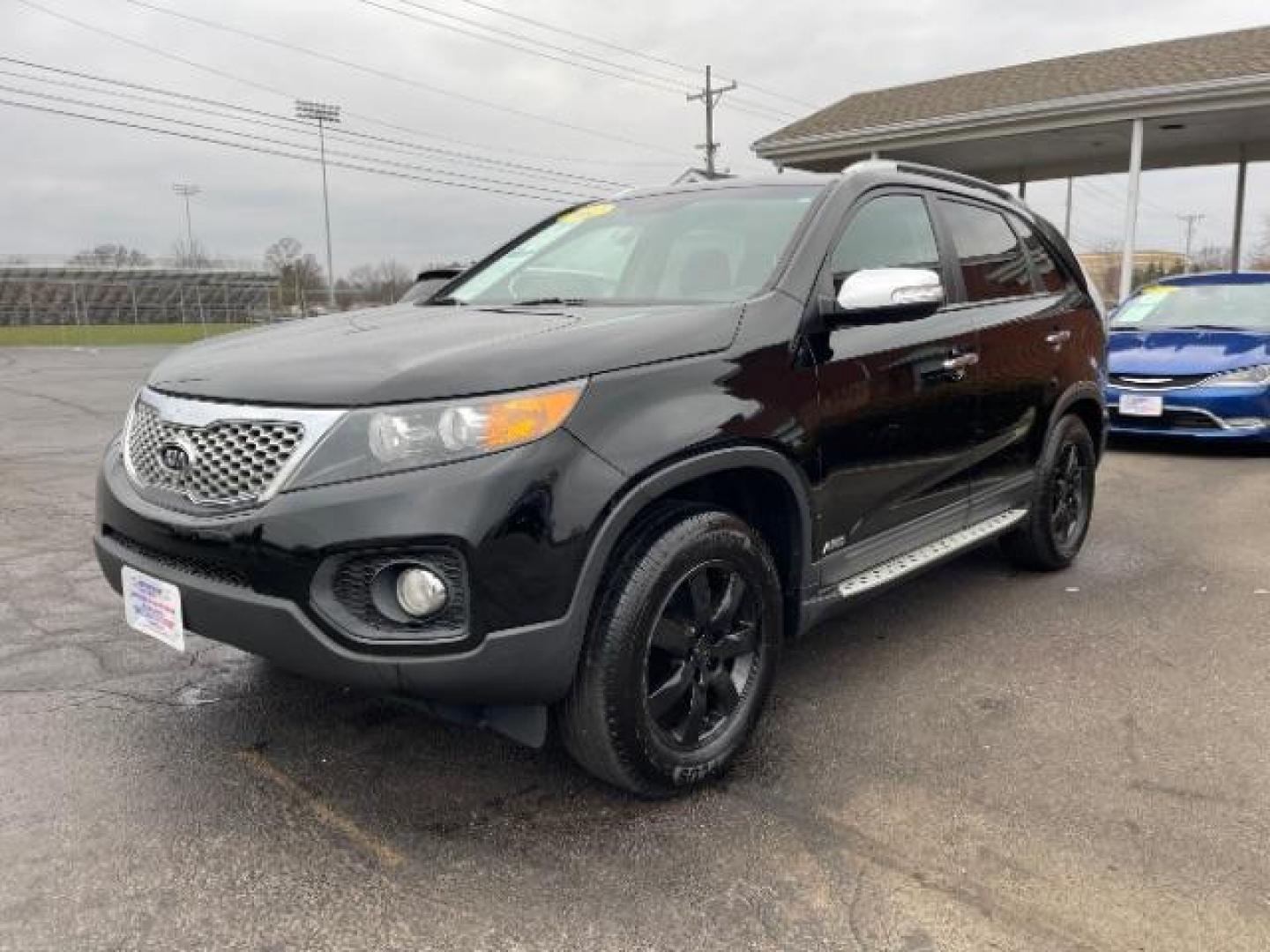 2012 Ebony Black Kia Sorento LX 4WD (5XYKTCA62CG) with an 2.4L L4 DOHC 16V engine, 6-Speed Automatic transmission, located at 880 E. National Road, Vandalia, OH, 45377, (937) 908-9800, 39.891918, -84.183594 - Photo#1