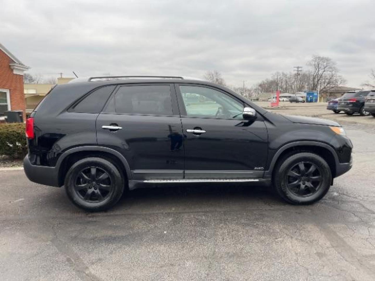 2012 Ebony Black Kia Sorento LX 4WD (5XYKTCA62CG) with an 2.4L L4 DOHC 16V engine, 6-Speed Automatic transmission, located at 880 E. National Road, Vandalia, OH, 45377, (937) 908-9800, 39.891918, -84.183594 - Photo#3