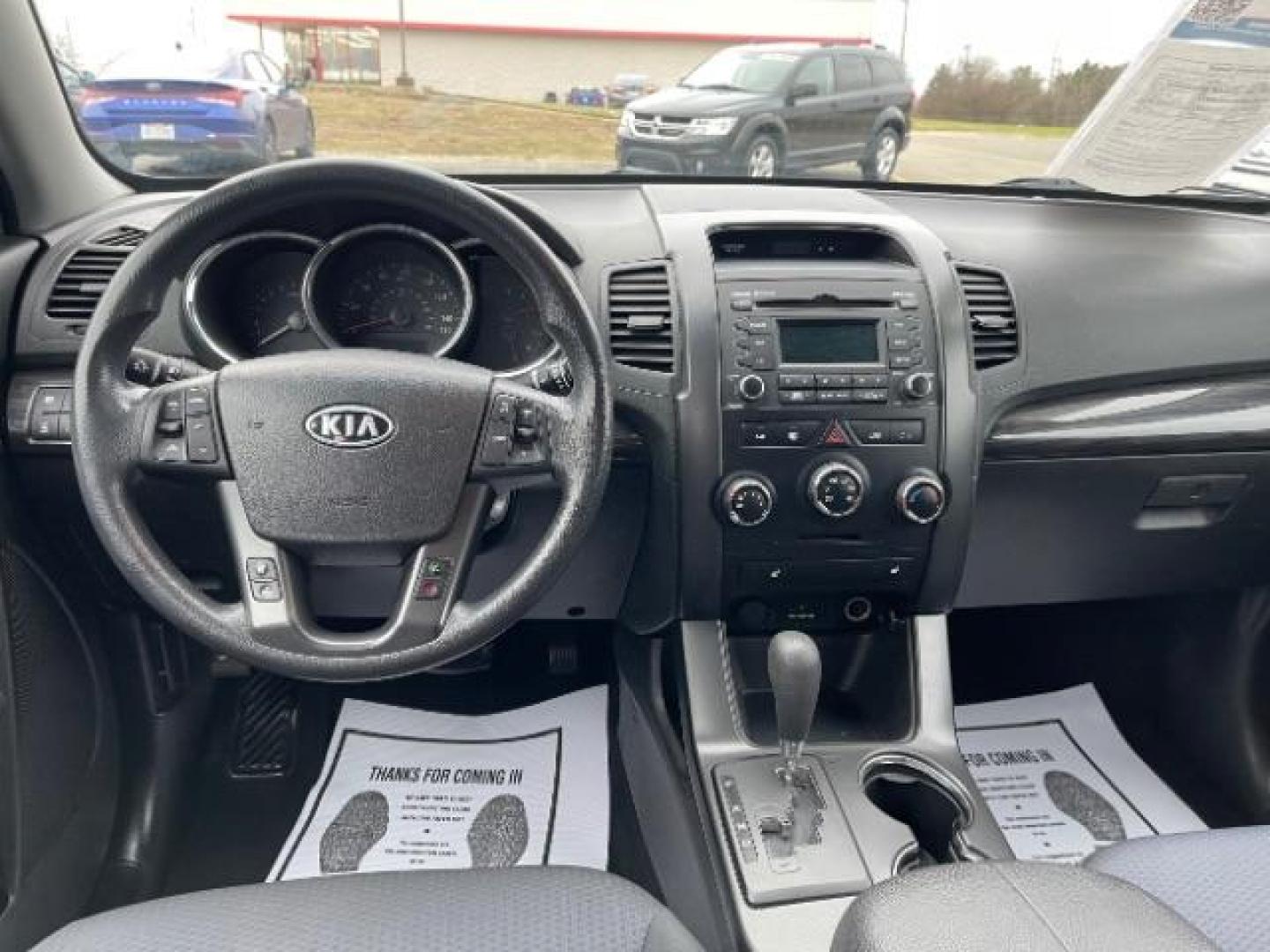 2012 Ebony Black Kia Sorento LX 4WD (5XYKTCA62CG) with an 2.4L L4 DOHC 16V engine, 6-Speed Automatic transmission, located at 880 E. National Road, Vandalia, OH, 45377, (937) 908-9800, 39.891918, -84.183594 - Photo#7