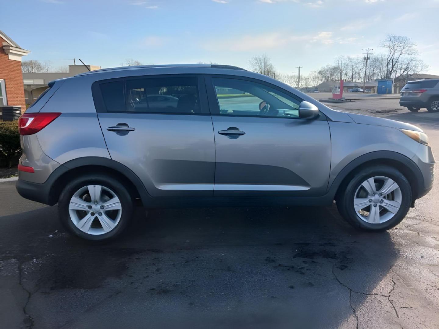 2012 Bright Silver Kia Sportage (KNDPB3A25C7) with an 2.4L V6 DOHC 24V engine, 6-Speed Automatic transmission, located at 4508 South Dixie Dr, Moraine, OH, 45439, (937) 908-9800, 39.689976, -84.218452 - Photo#5