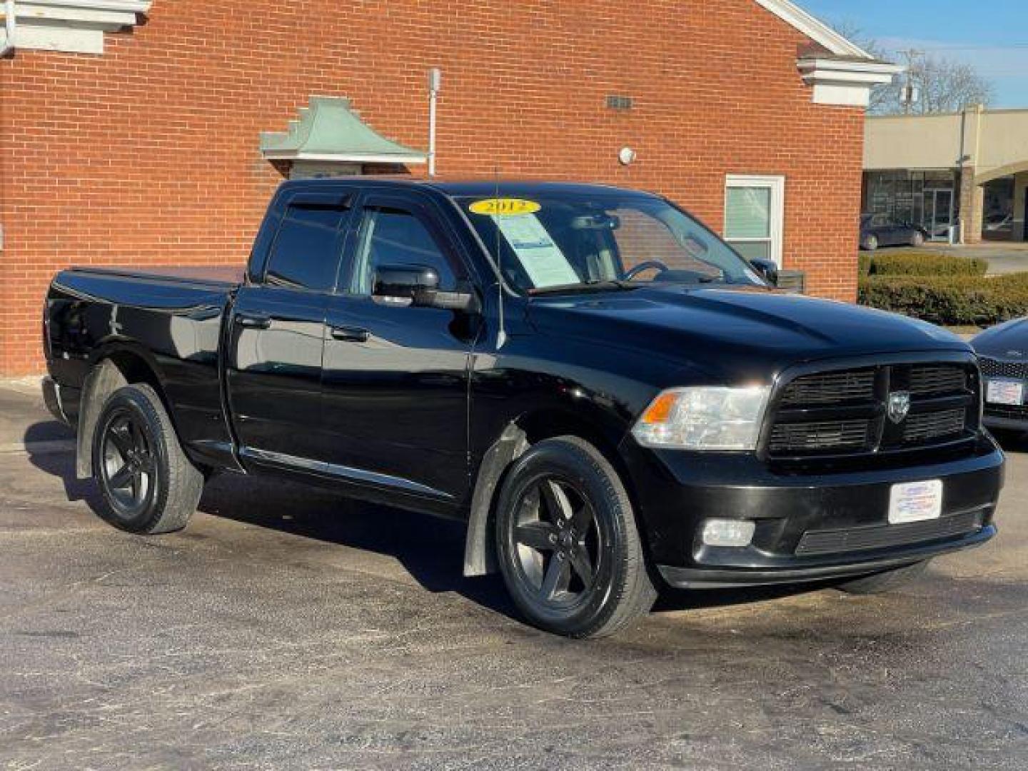 2012 Black RAM 1500 Sport Quad Cab 4WD (1C6RD7HT2CS) with an 5.7L V8 OHV 16V engine, 6-Speed Automatic transmission, located at 401 Woodman Dr, Riverside, OH, 45431, (937) 908-9800, 39.760899, -84.123421 - Photo#0