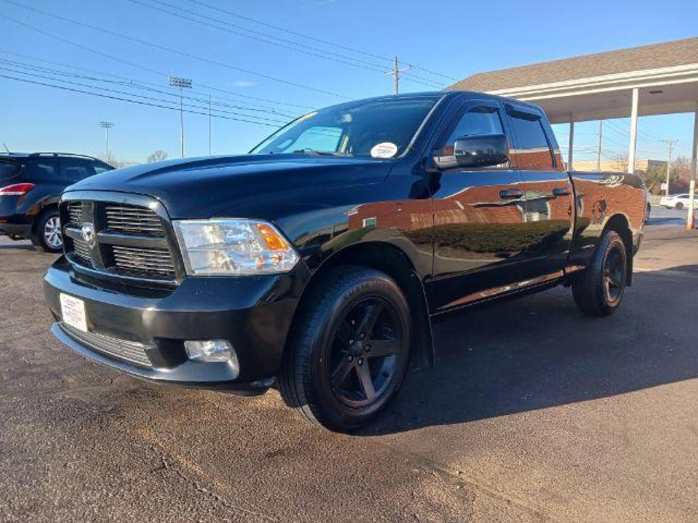 2012 Black RAM 1500 Sport Quad Cab 4WD (1C6RD7HT2CS) with an 5.7L V8 OHV 16V engine, 6-Speed Automatic transmission, located at 401 Woodman Dr, Riverside, OH, 45431, (937) 908-9800, 39.760899, -84.123421 - Photo#2