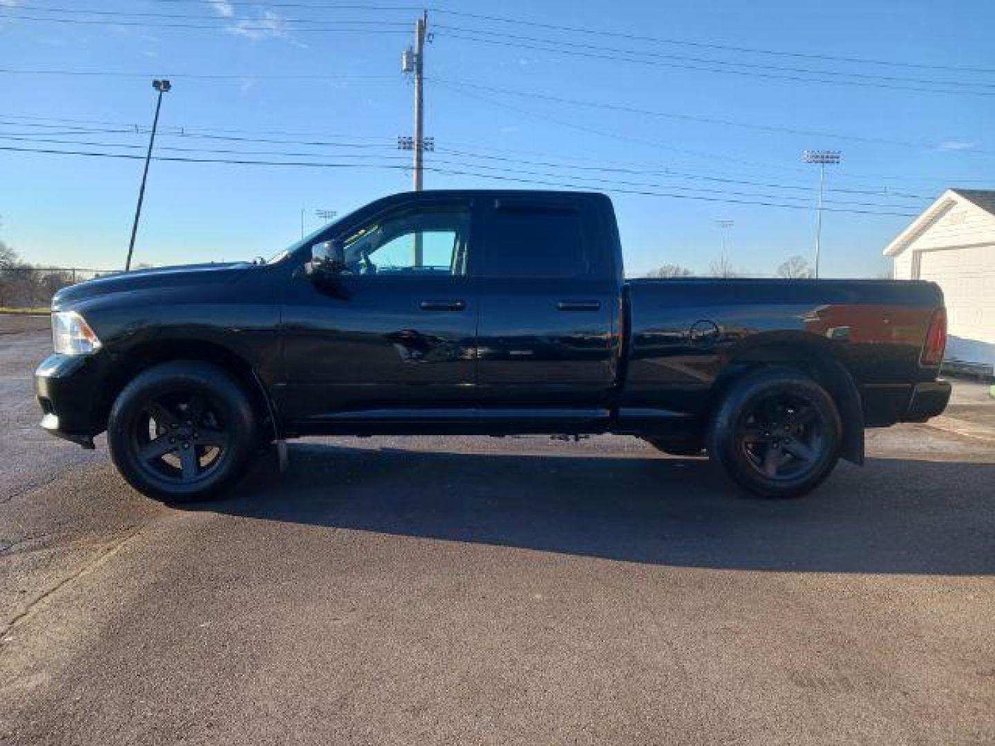 2012 Black RAM 1500 Sport Quad Cab 4WD (1C6RD7HT2CS) with an 5.7L V8 OHV 16V engine, 6-Speed Automatic transmission, located at 401 Woodman Dr, Riverside, OH, 45431, (937) 908-9800, 39.760899, -84.123421 - Photo#3