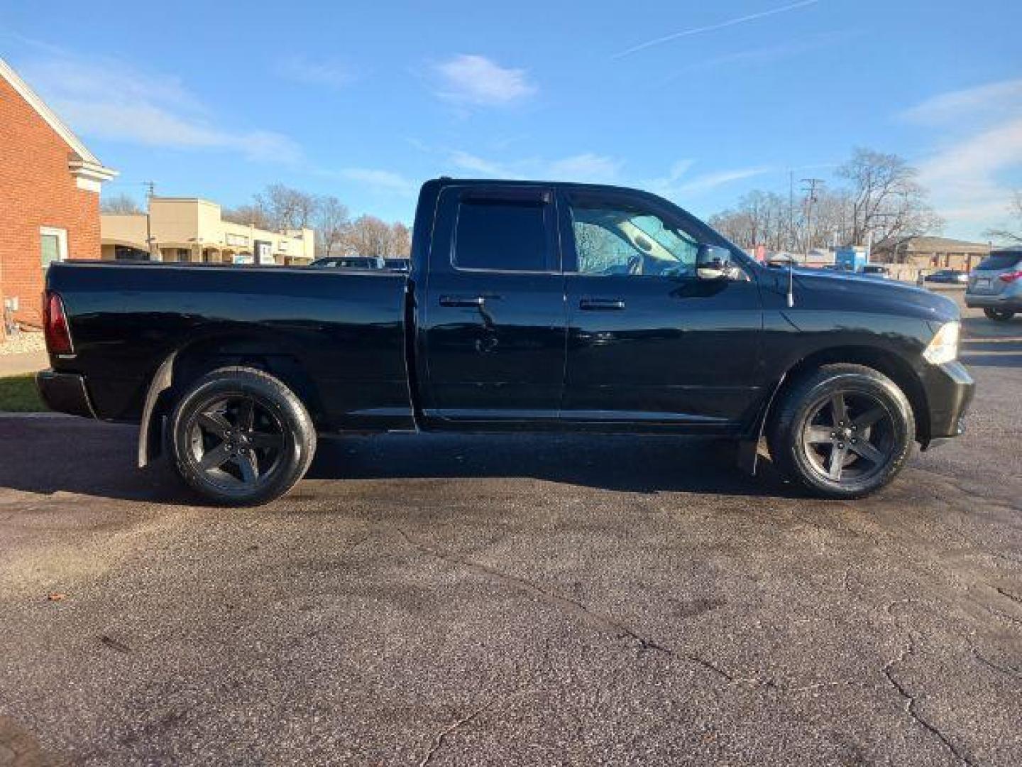 2012 Black RAM 1500 Sport Quad Cab 4WD (1C6RD7HT2CS) with an 5.7L V8 OHV 16V engine, 6-Speed Automatic transmission, located at 401 Woodman Dr, Riverside, OH, 45431, (937) 908-9800, 39.760899, -84.123421 - Photo#4