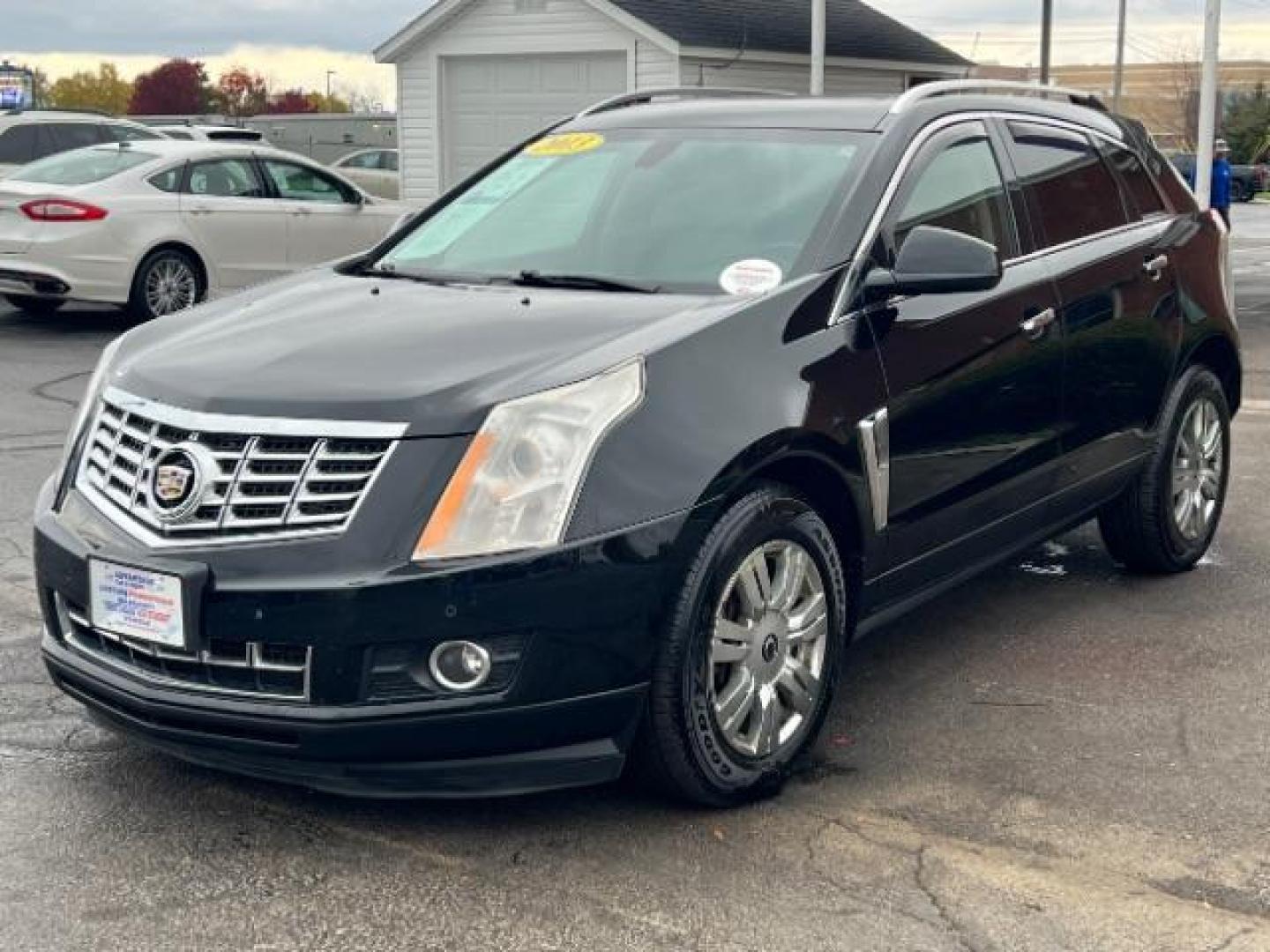 2013 Black Raven Cadillac SRX AWD Luxury Collection (3GYFNGE36DS) with an 3.6L V6 DOHC 24V FFV engine, 6-Speed Automatic transmission, located at 1099 N County Rd 25A , Troy, OH, 45373, (937) 908-9800, 40.057079, -84.212883 - Photo#2